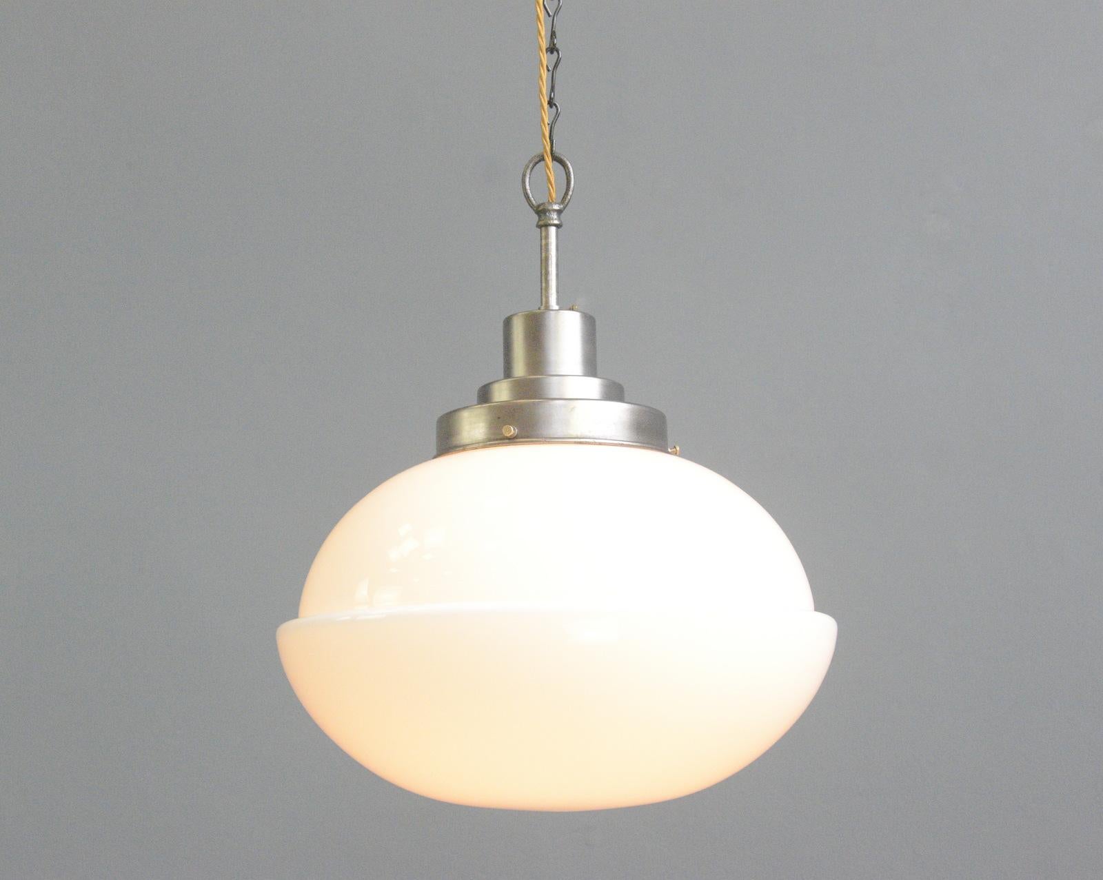 - Large single step opaline glass shade
- Steel gallery
- E27 fitting bulb holder
- Belgian ~ 1930s
- 40cm wide x 44cm tall

Condition report

Fully re wired with modern electrical components, some patina to the gallery but no damage to the