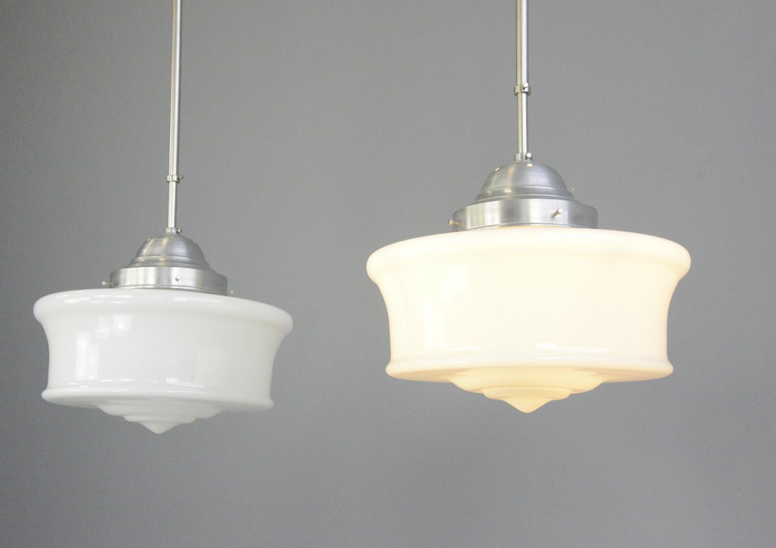 Large opaline pendant lights Circa 1930s

- Price is per light (2 available)
- Thick opaline glass shades
- Height adjustable stems
- Takes E27 fitting bulbs
- Danish ~ 1930s
- 50cm wide x 46cm tall inc gallery
- 112cm tall with stem at its