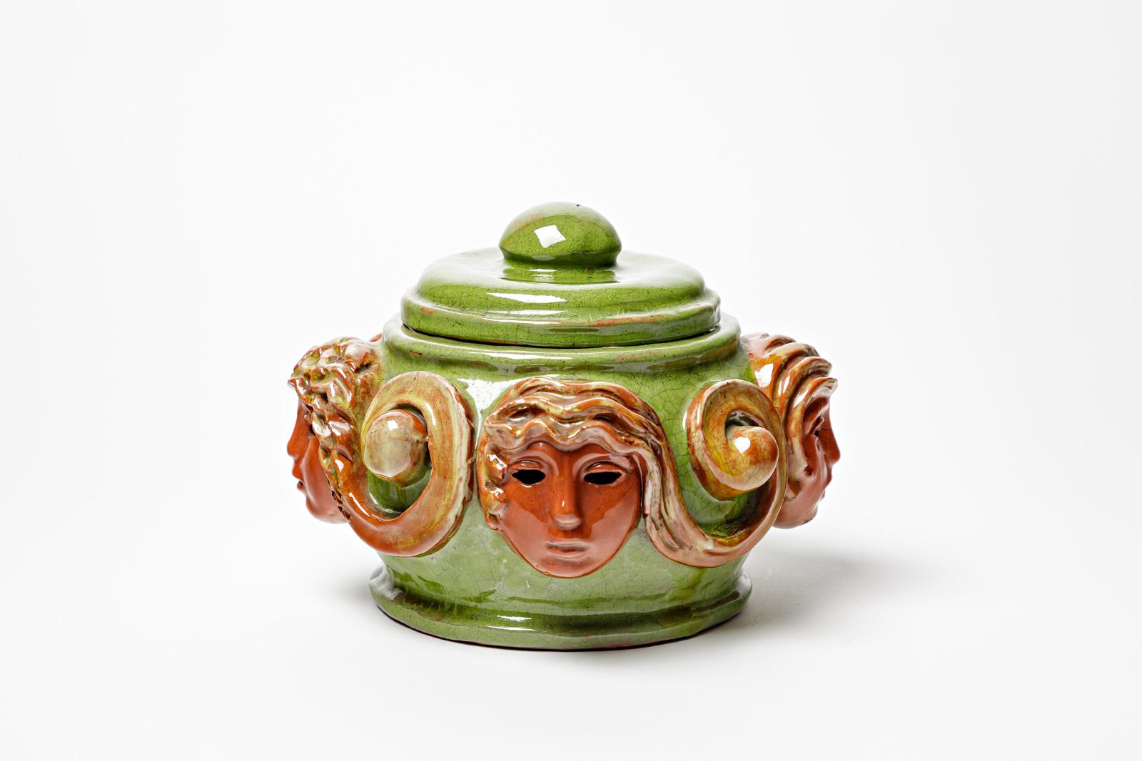 Attributed to / in the style of Paul Pouchol

Large art decorative ceramic box

Orange and green ceramic glazes colors

Original perfect condition

Signed under the base

Realised circa 1940

Height 16 cm
Large 21 cm