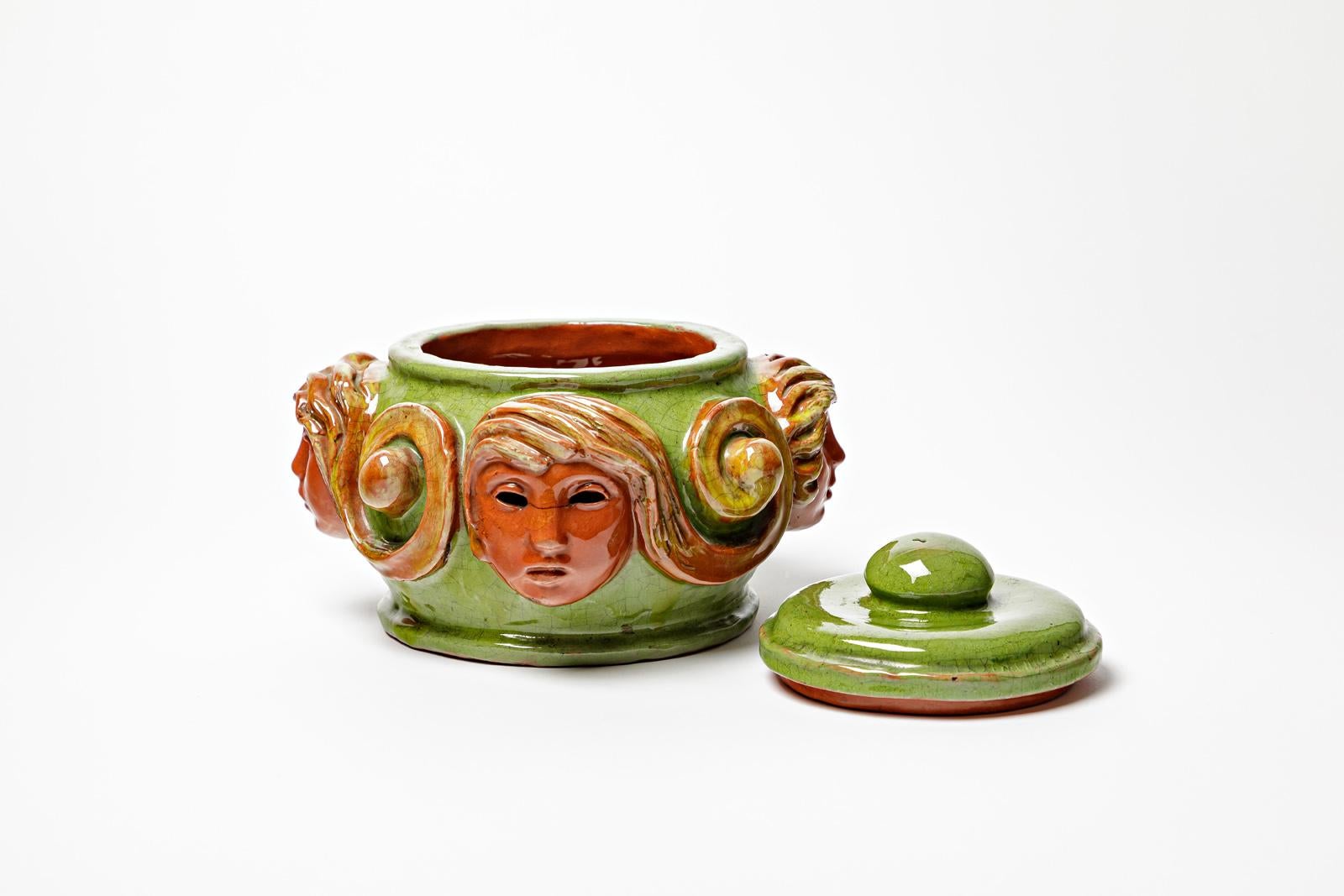 French Large orange and green visages art deco decorative box att. to Paul Pouchol For Sale