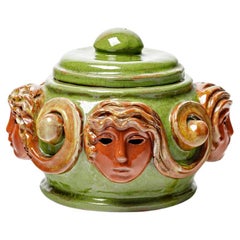 Large orange and green visages art deco decorative box att. to Paul Pouchol