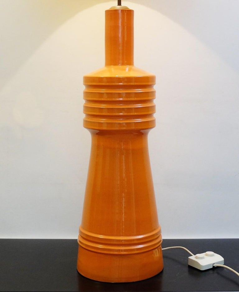 Large orange ceramic table lamp with original shade.