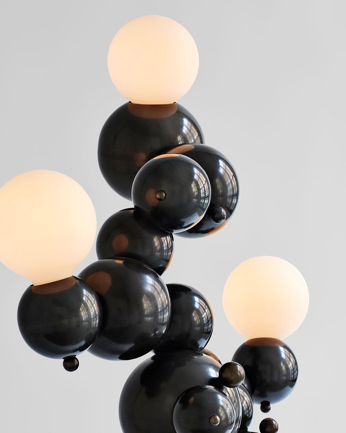 First-edition organic mid-size floor lamp with three lights made of interlocking spun brass spheres, from Rosie Li's 