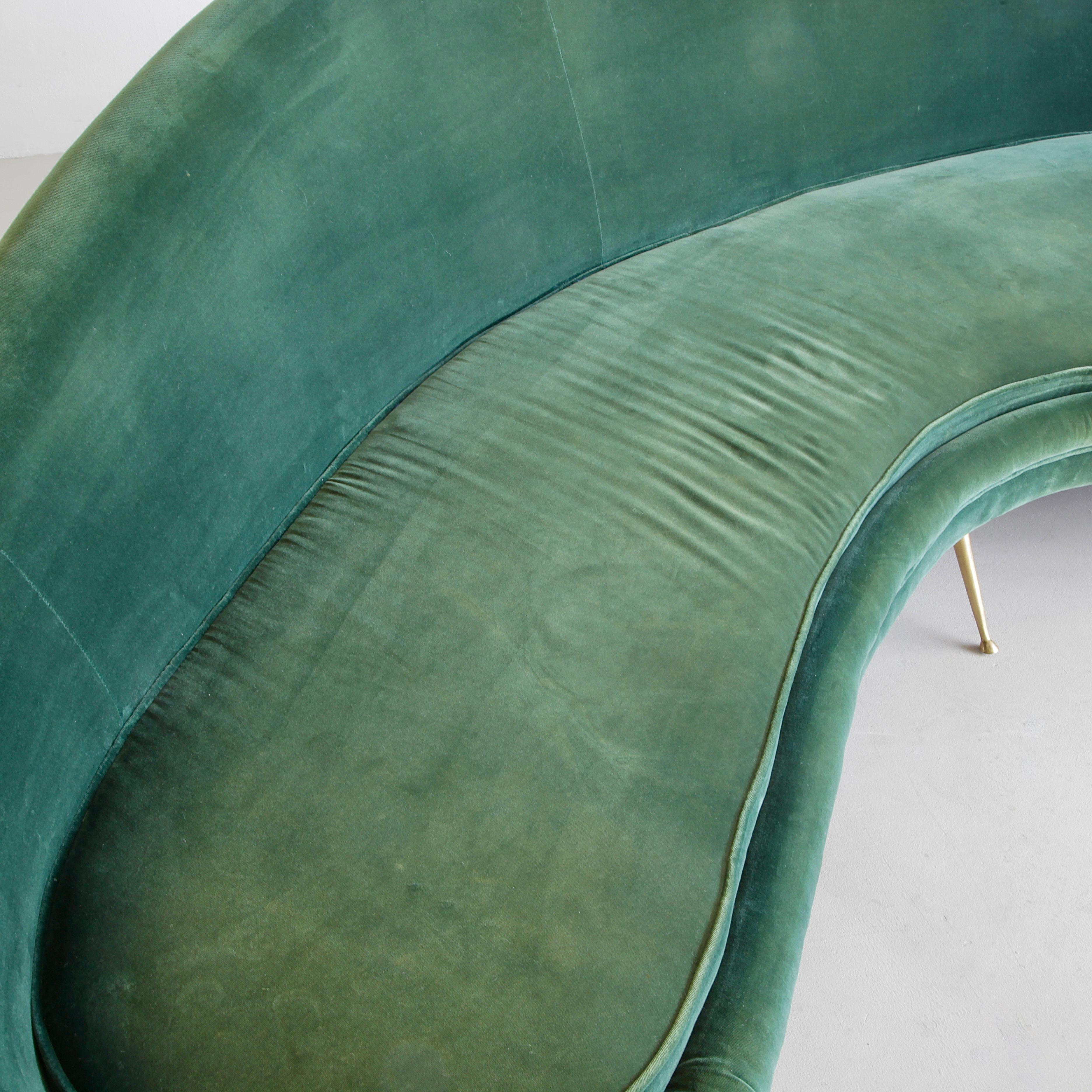 Curved Sofa in the style of Ico Parisi. Italy, 21st C.

A large curved sofa with beautifully shaped back and side rests. Upholstered in green velvet material and sitting on six brass legs.
Condition: 

Excellent vintage condition with minor
