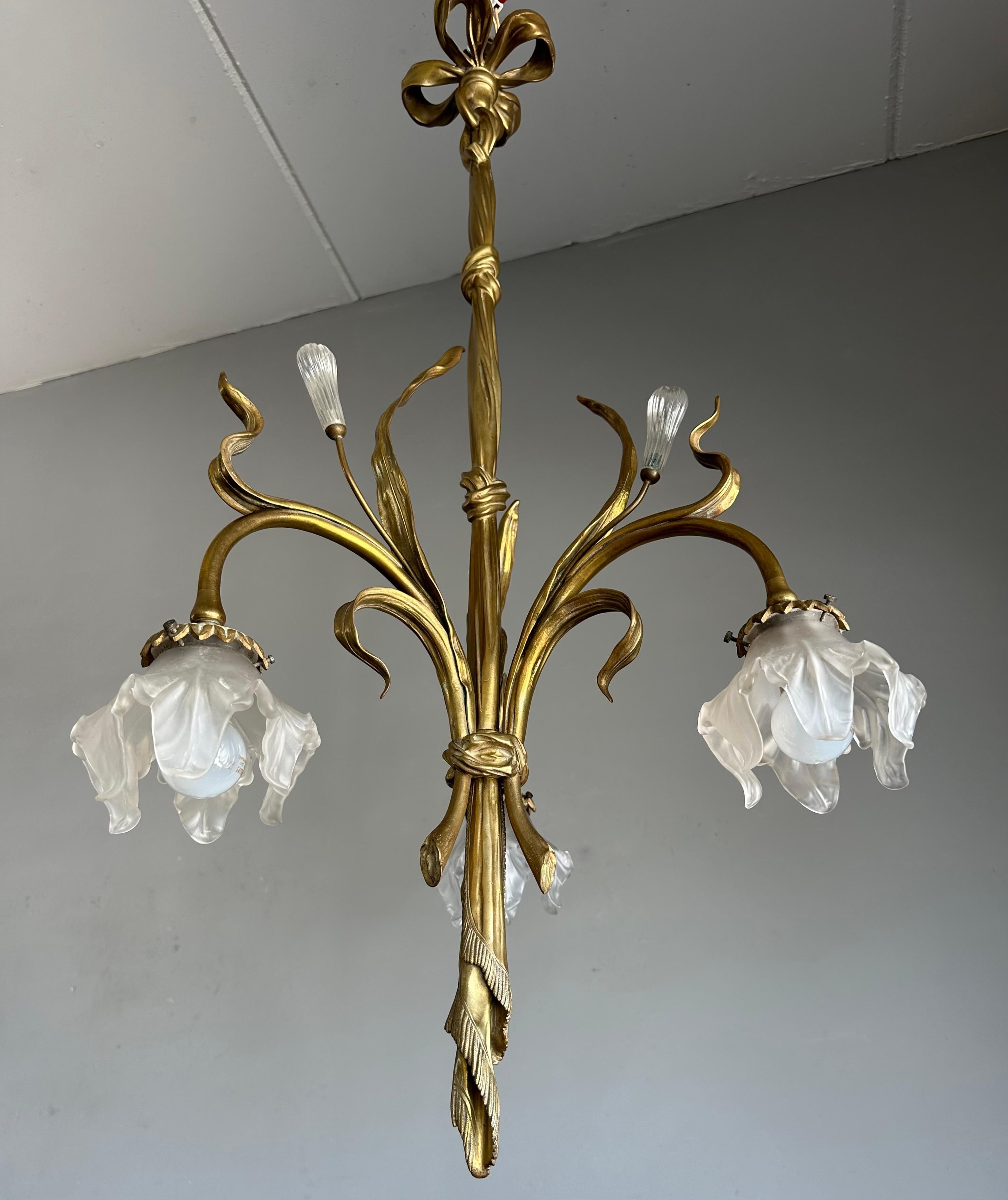 Rare and beautiful Art Nouveau, three light pendant light. 

This rare and wonderfully stylish Art Nouveau pendant dates from the earlier days of European, indoor lighting. This large, bronze and brass chandelier in this stunning Art Nouveau style
