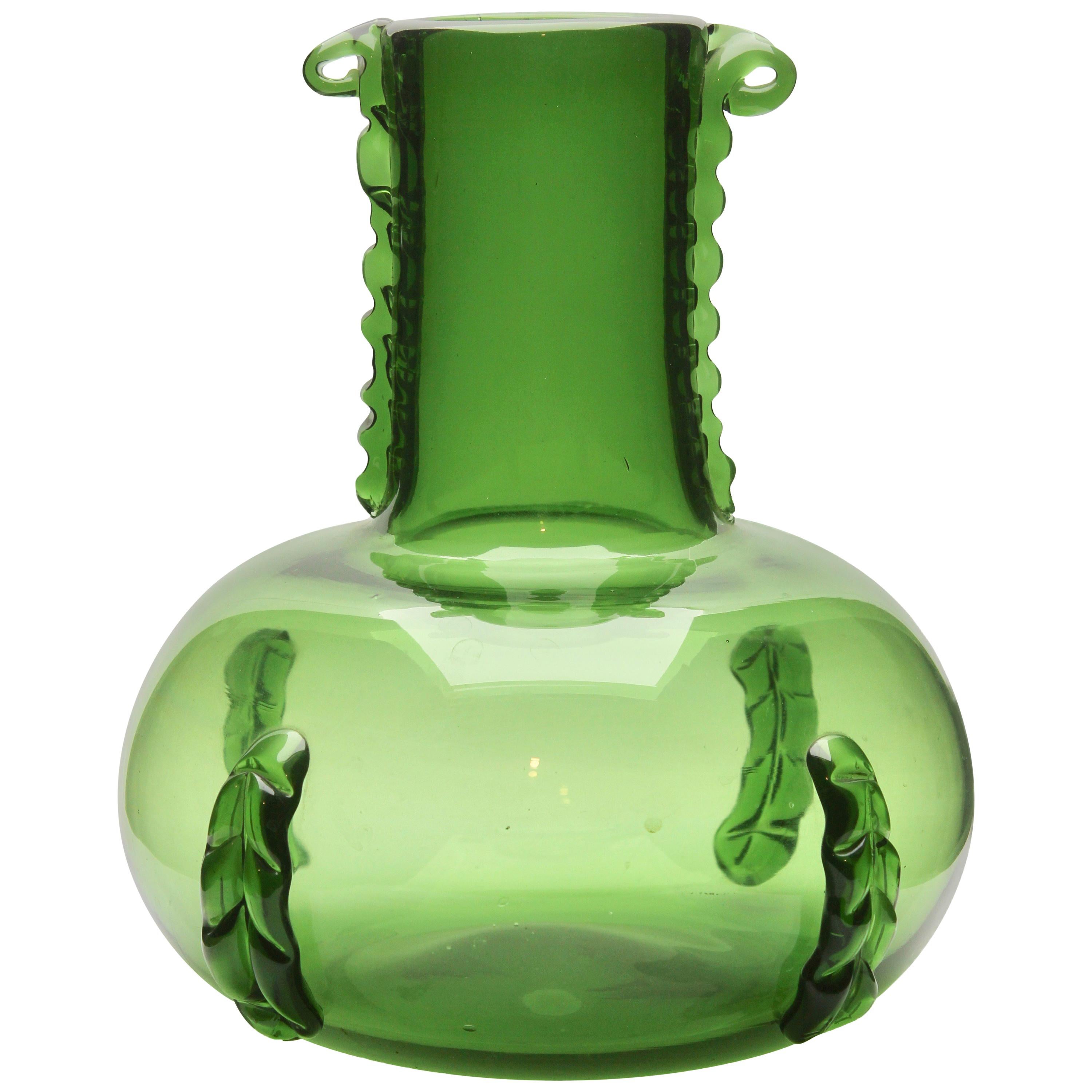 Made by the Italian craftsmen of Empoli, Florence

The carefully crafted details add flowing organic motifs, and act as a handle to ensure it can be safely carried.
The large, usable vase provides a solid pitcher form suitable for a few tall