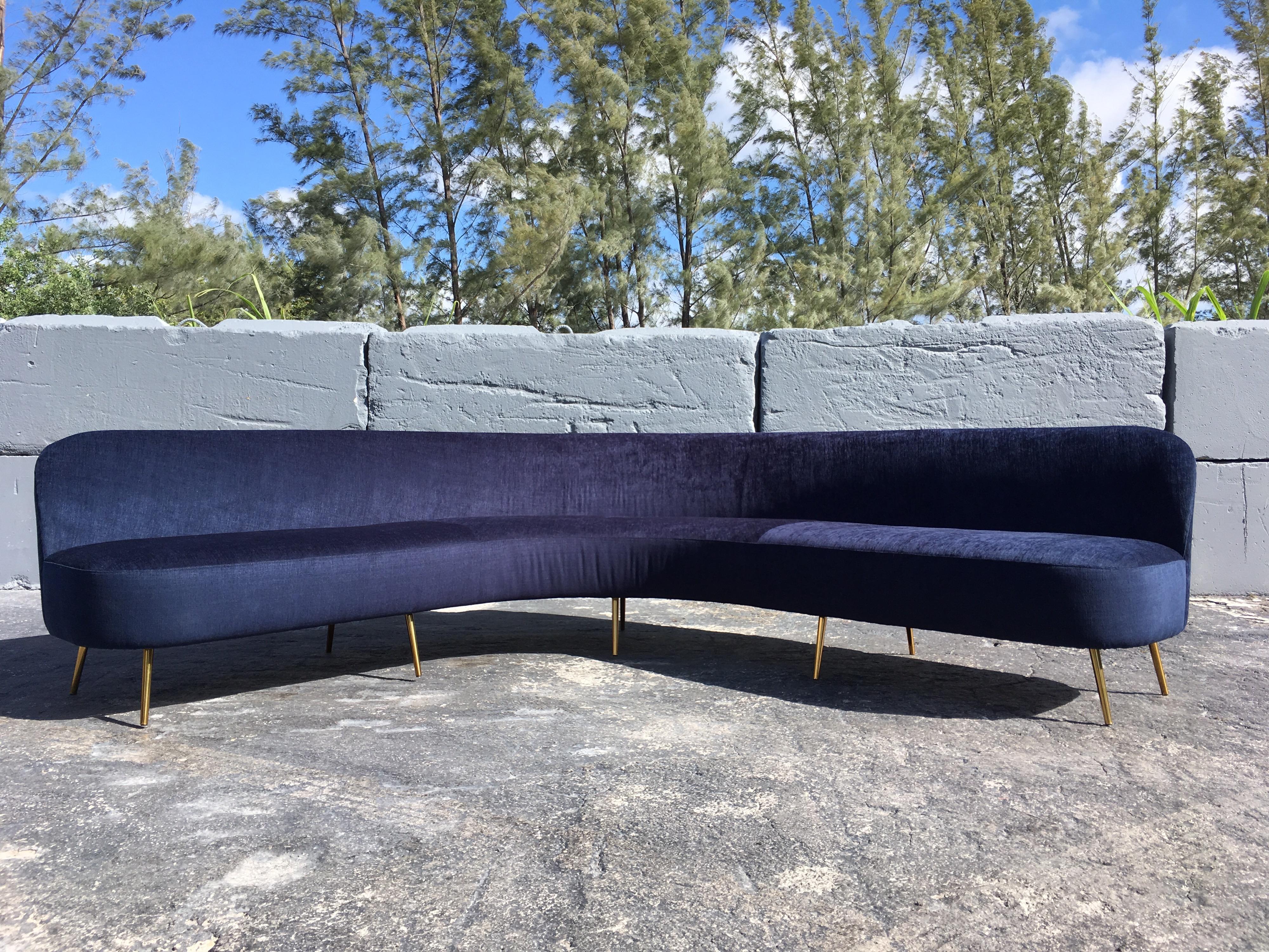 Beautiful large organic sofa standing on ten brass plated legs. The dark blue Knoll fabric is new, in some pictures the fabric may appear purple but it really is more a dark blue. Great sofa and ready for a new home.