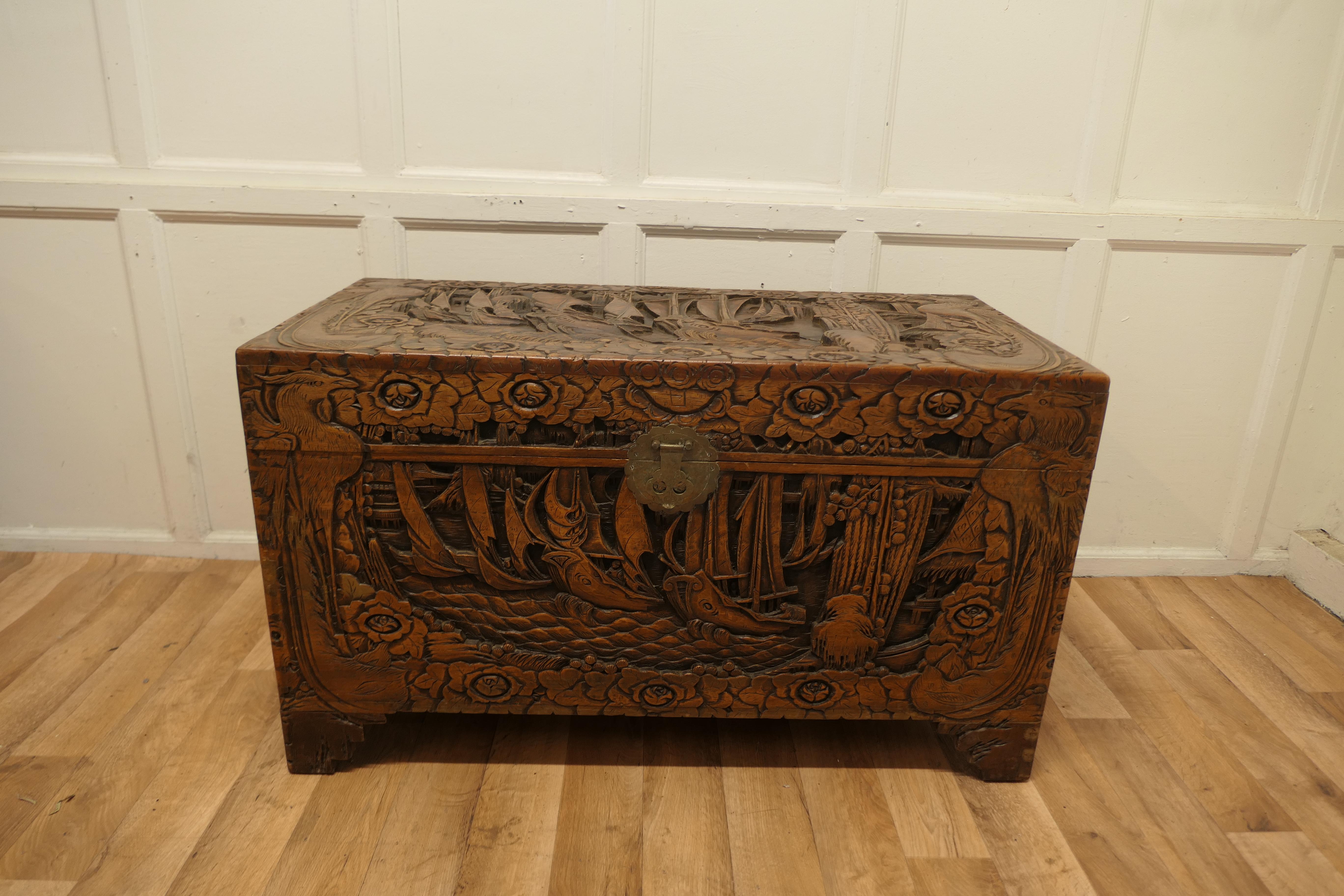 Large Oriental Carved camphor wood chest

This Beautiful Carved Chest is made from Camphor Wood, for those of you who do not know camphor wood it looks a lot like Mahogany it is a hard wood which lends itself very well to carving.

However the