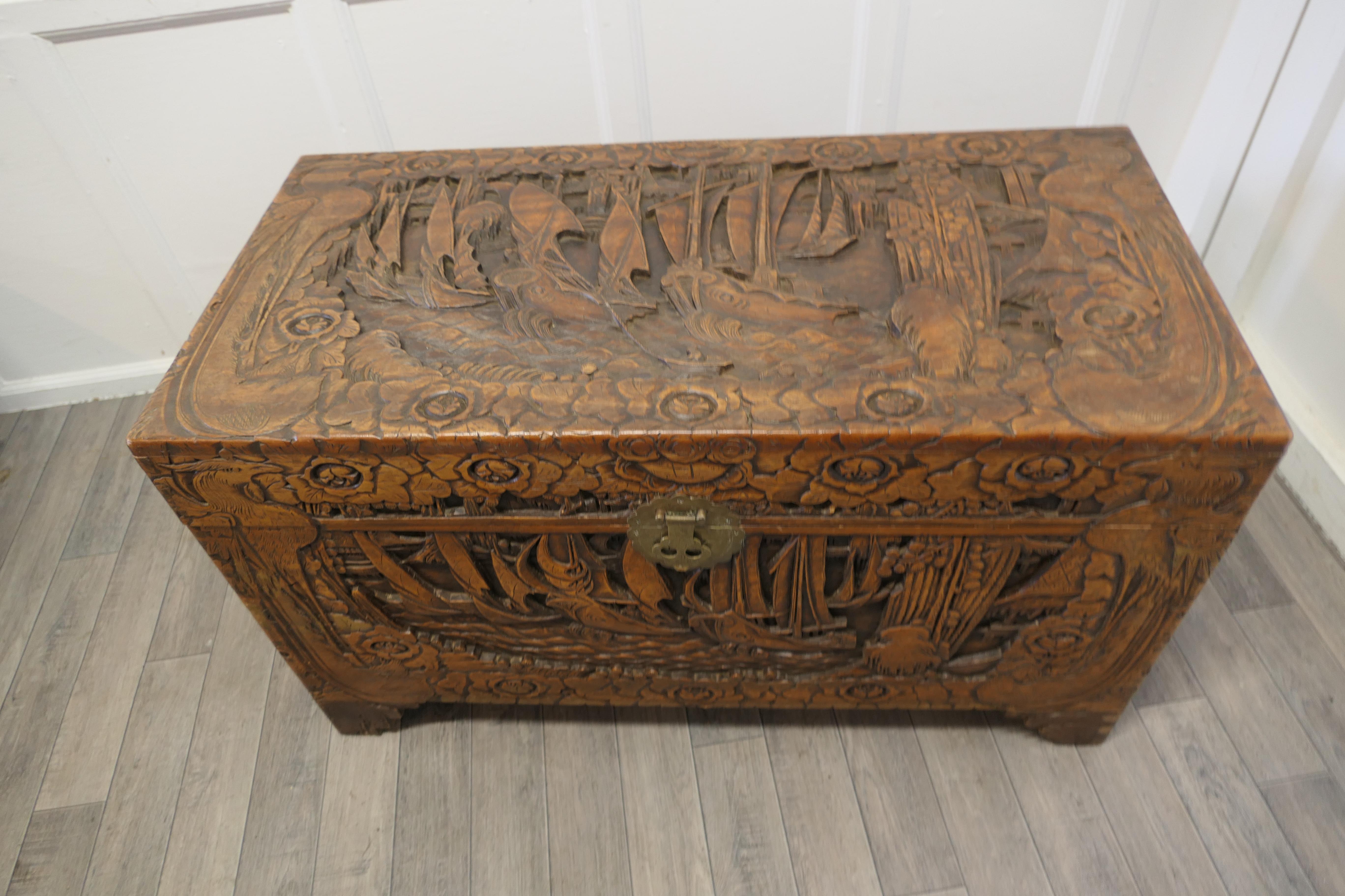 Large oriental carved camphor wood chest

This Beautiful Carved Chest is made from Camphor Wood, for those of you who do not know camphor wood it looks a lot like Mahogany it is a hard wood which lends itself very well to carving.

However the