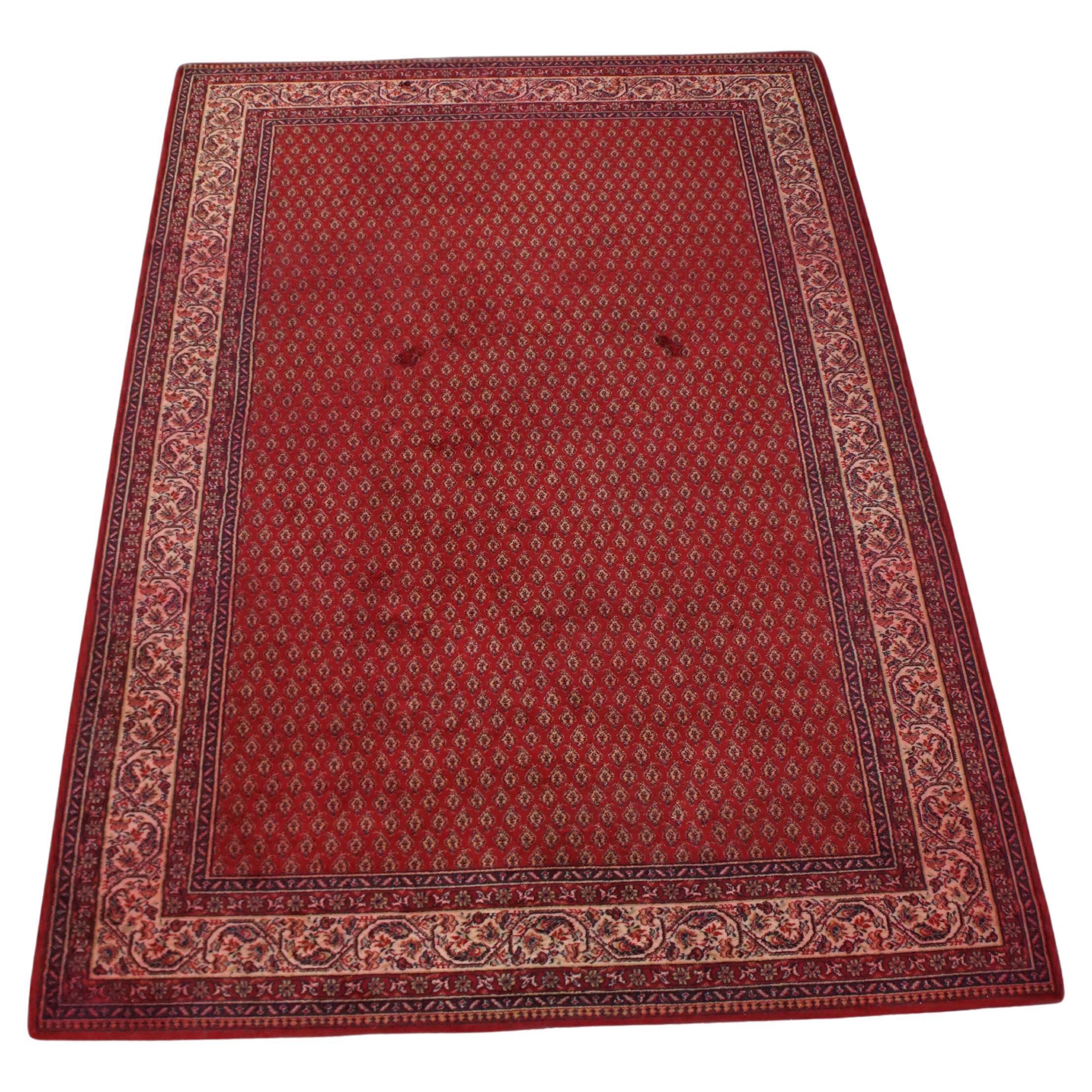 Grand tapis d'Orient aux couleurs rouges et violettes principalement, 300 x 200 cm