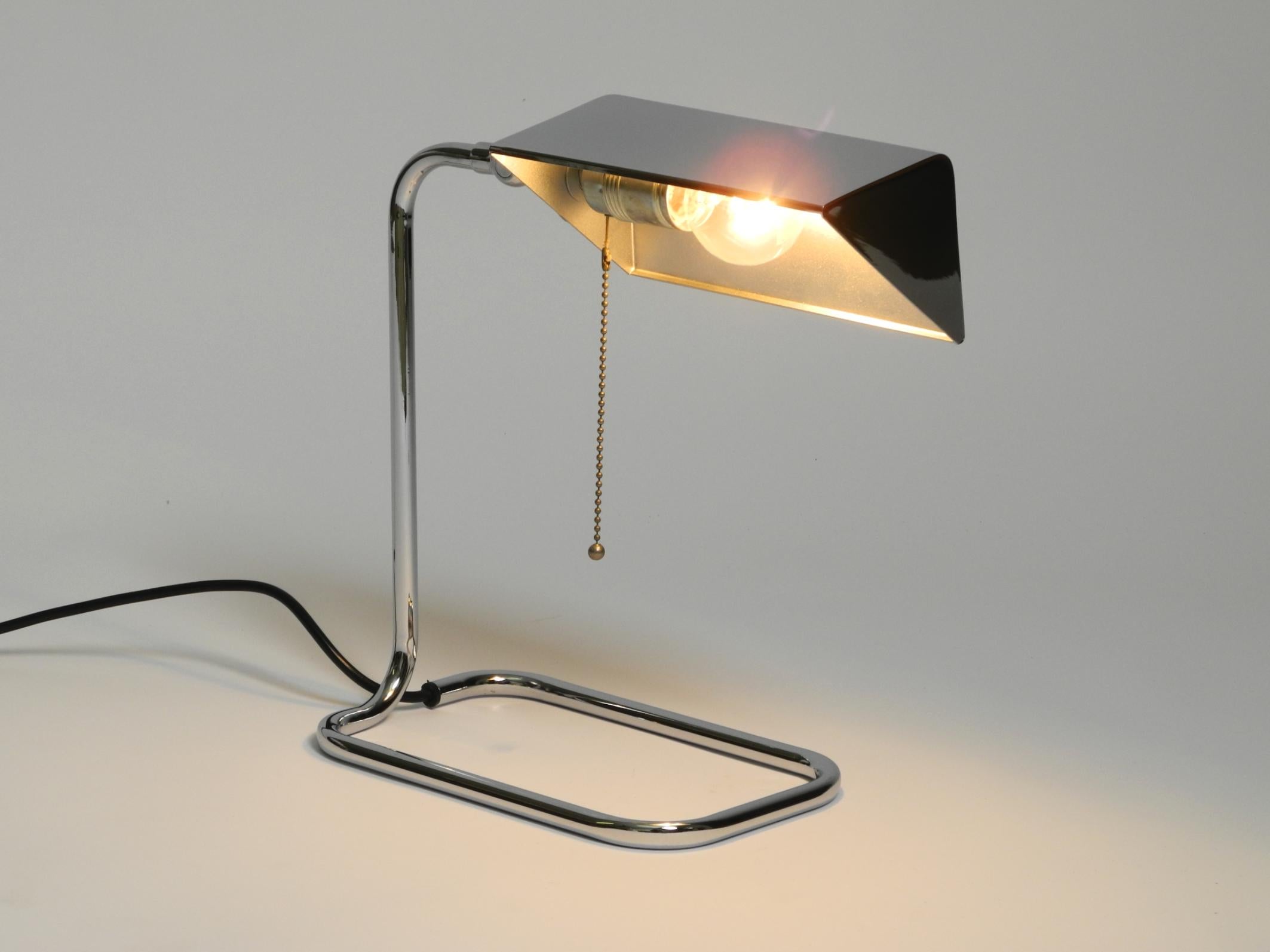Large, beautiful original 1980s chrome-plated table lamp.
Manufactured by Florian Schulz. Made in Germany.
The shade can be rotated 360° and tilted continuously.
Very good vintage condition with no damage to the shade and frame.
No bumps, dents or
