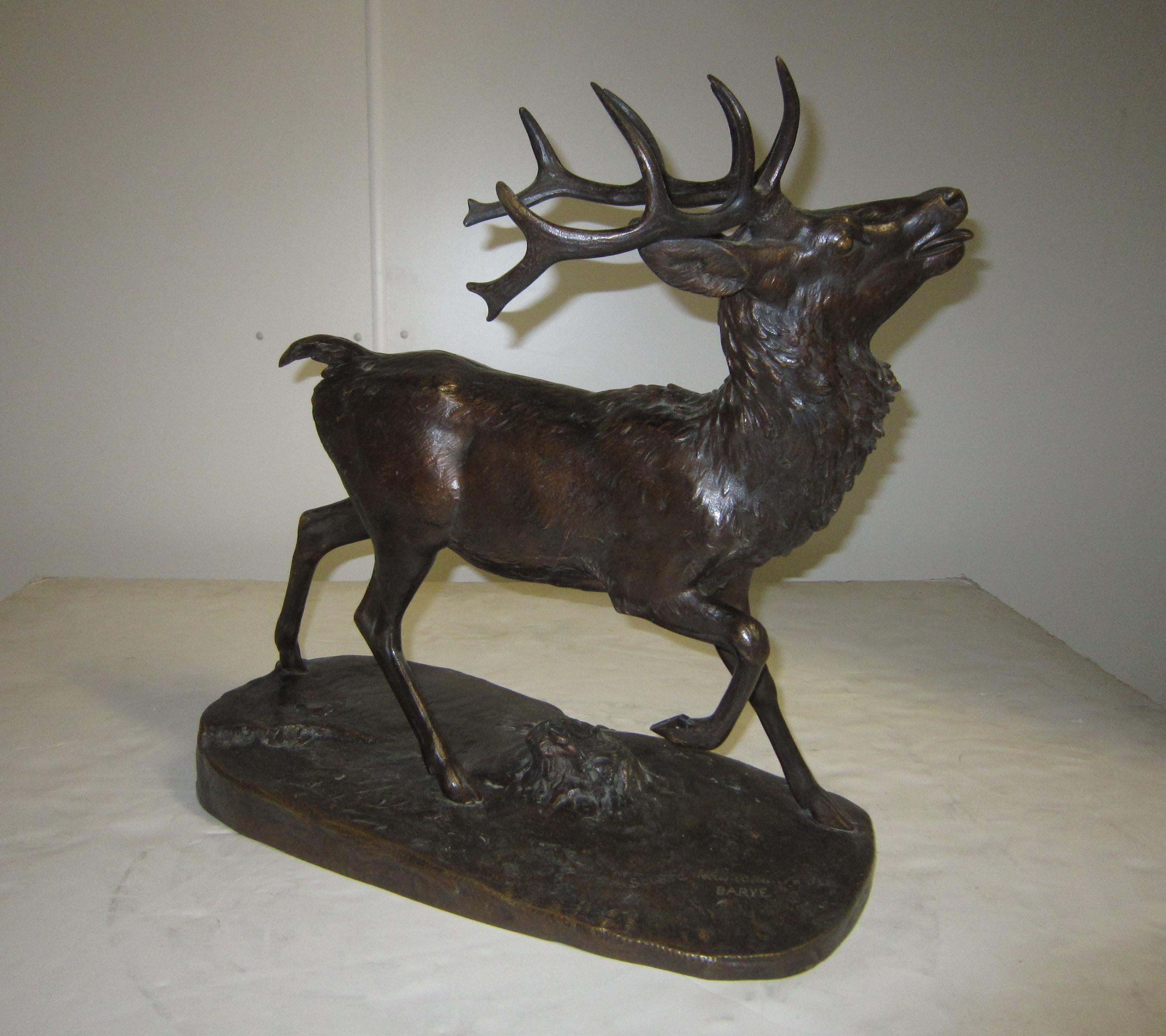 A beautiful original antique bronze sculpture of a standing stag 