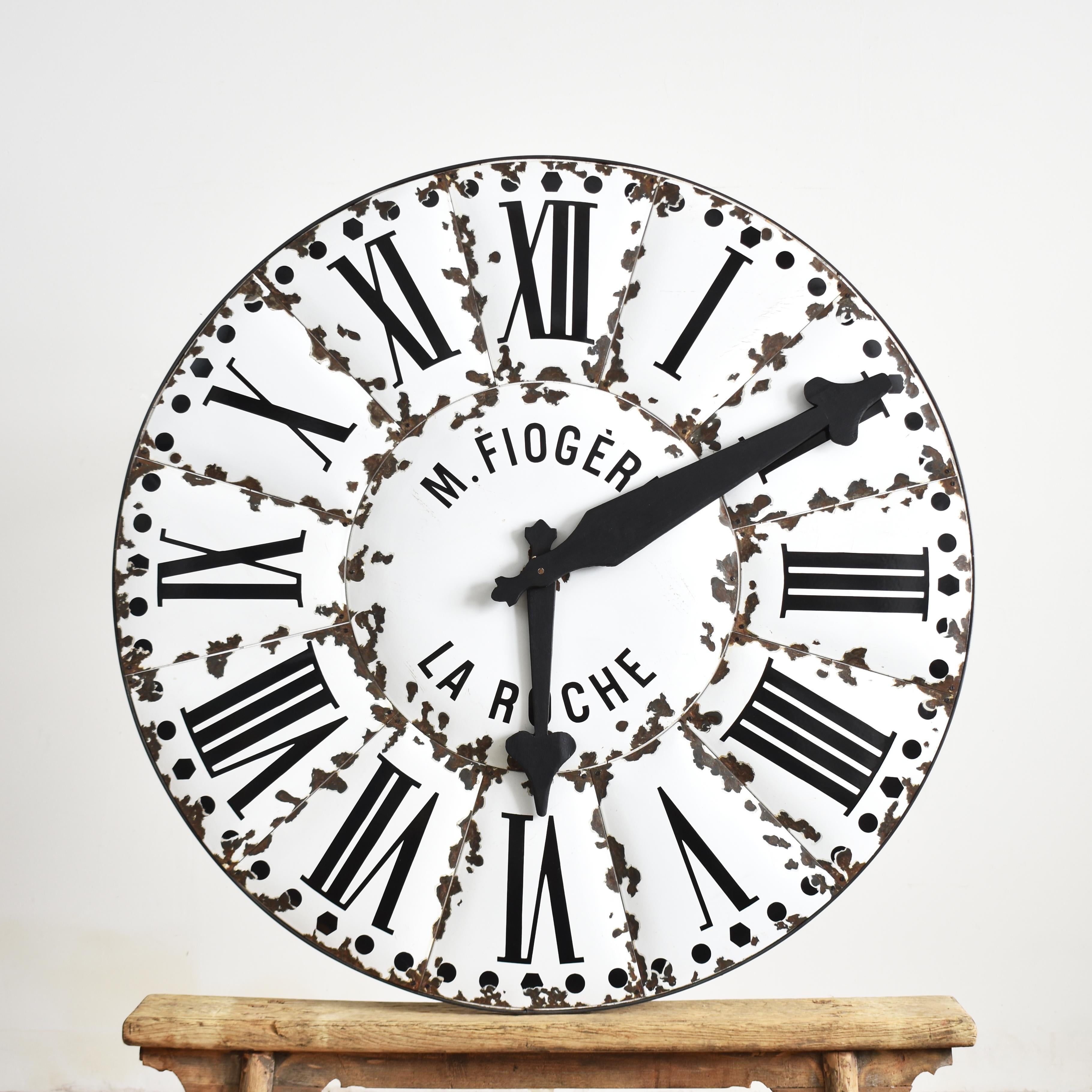 Large Original Enamel Antique French Tower Clock Face

A stunning turn of the century original turret clock face from La Roche, France. The clock face is made up of individual white enamel convex pieces with contrasting black Roman numerals. The