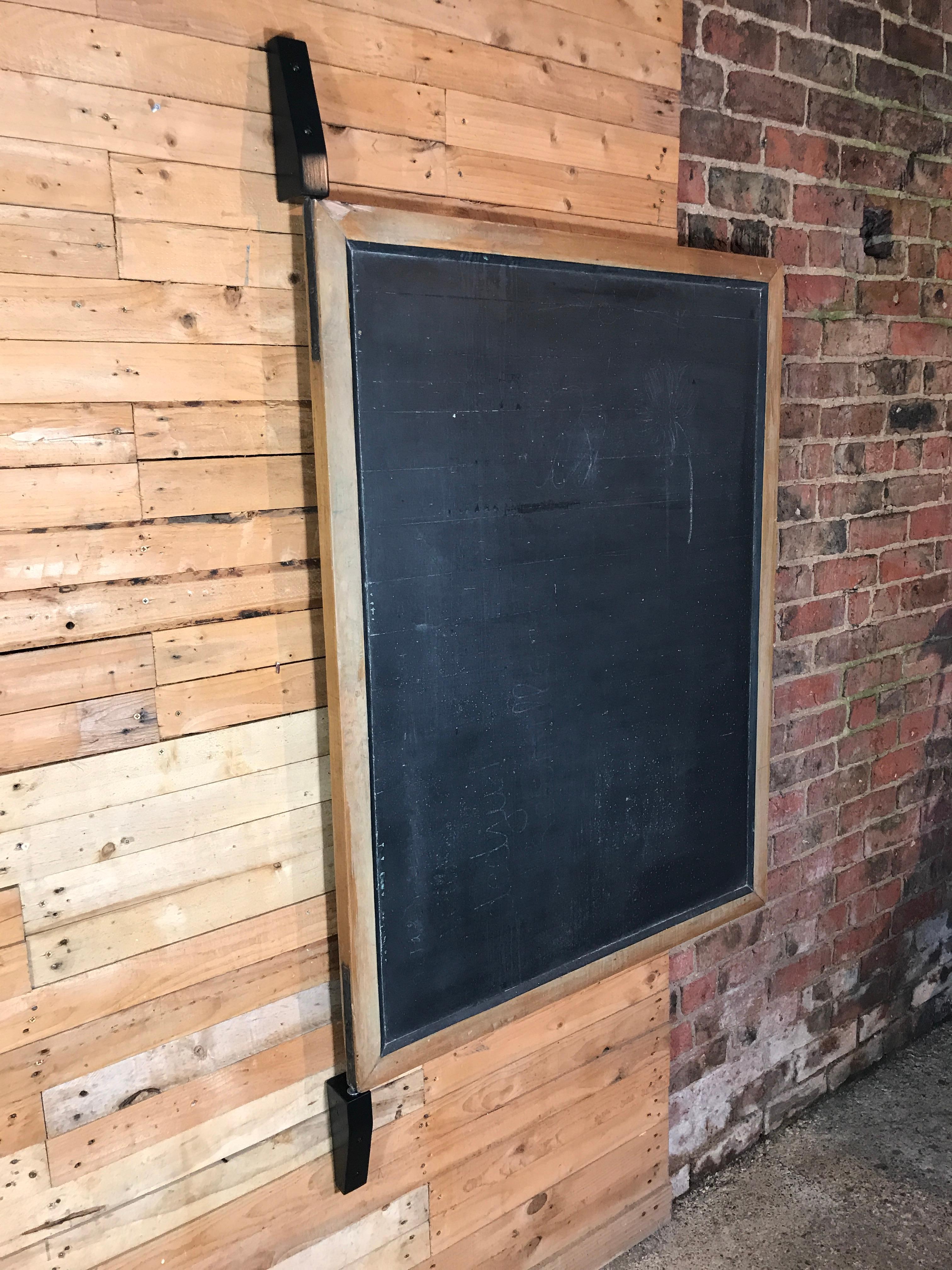 Industrial blackboard with wooden wall attachment, board swings around so ideal for restaurants which have a lunch menu on one side and dinner offer on the other side.

Measures: Total height 170 cm, board 130 cm, depth 11cm, width 103 cm.