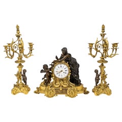 Large Ormolu and Patinated Bronze Mantel Set, Napoleon III Period, 19th Century. Large Ormolu and Patinated Bronze Mantel Set, Napoleon III Period, 19th Century.