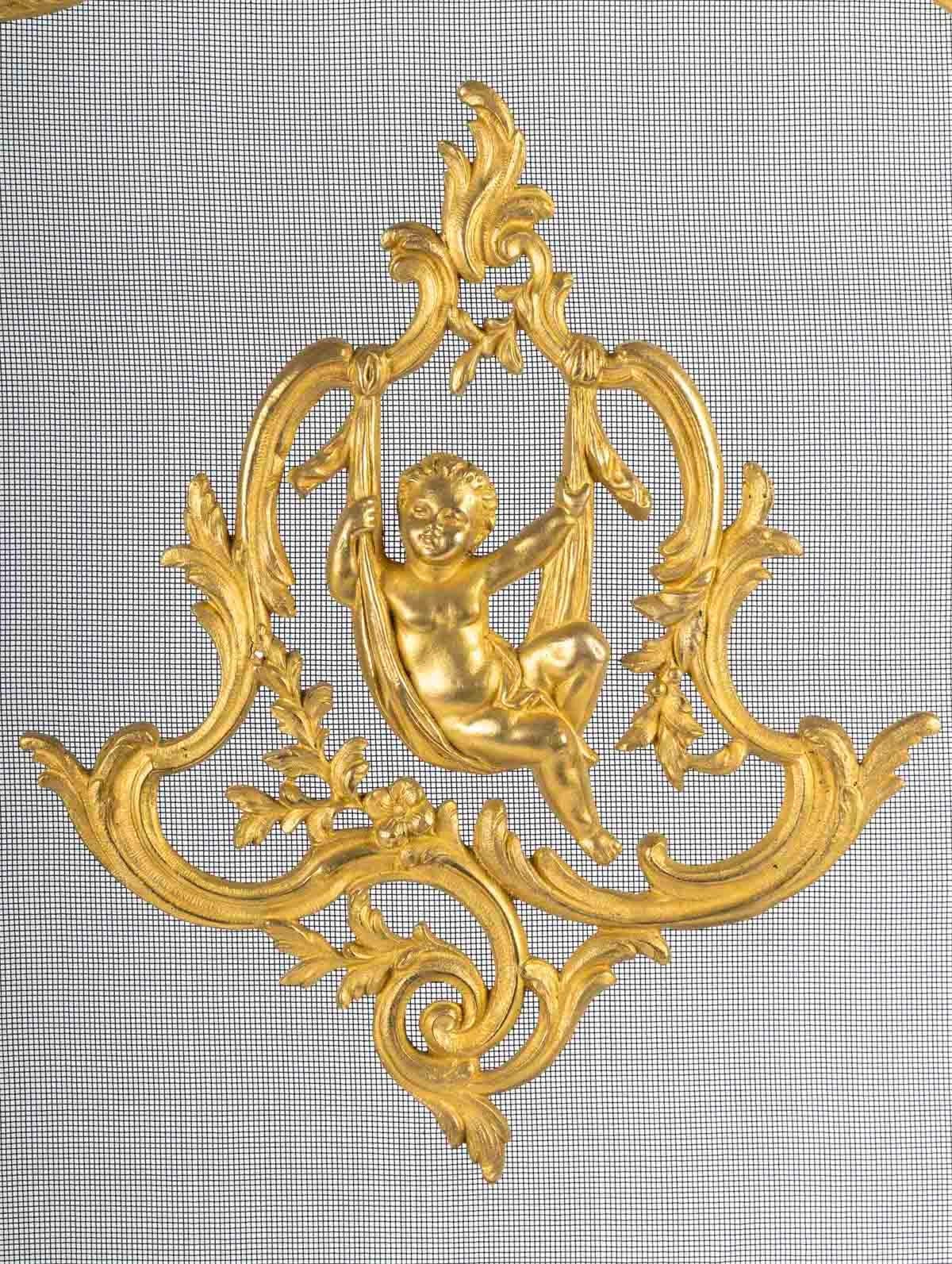 Large ormolu fire screen in the Louis XV style.

Large Napoleon III period ormolu fire screen in the Louis XV style, 19th century.
H: 80cm. W: 70cm, D: 22cm