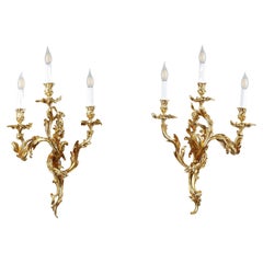 Large ormolu three-light sconces