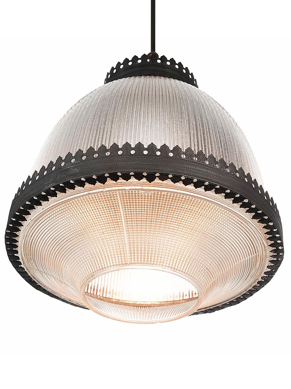 This is an interesting 2 part domed Holophane. There is an ornate crown as well as a decorative banding. This is the type of high style industrial lamp used in banks, lobbies and municipal buildings. The curved undercut section is very unique.