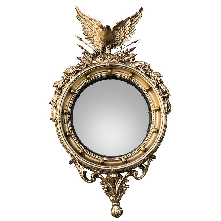 Classic Federal style extra large eagle mirror. 

The 13 balls surrounding the mirror is said to represent the original colonies. Sometimes called a fish eye mirror, this convex mirror has intricate details. The eagle at the top grasps a quill of