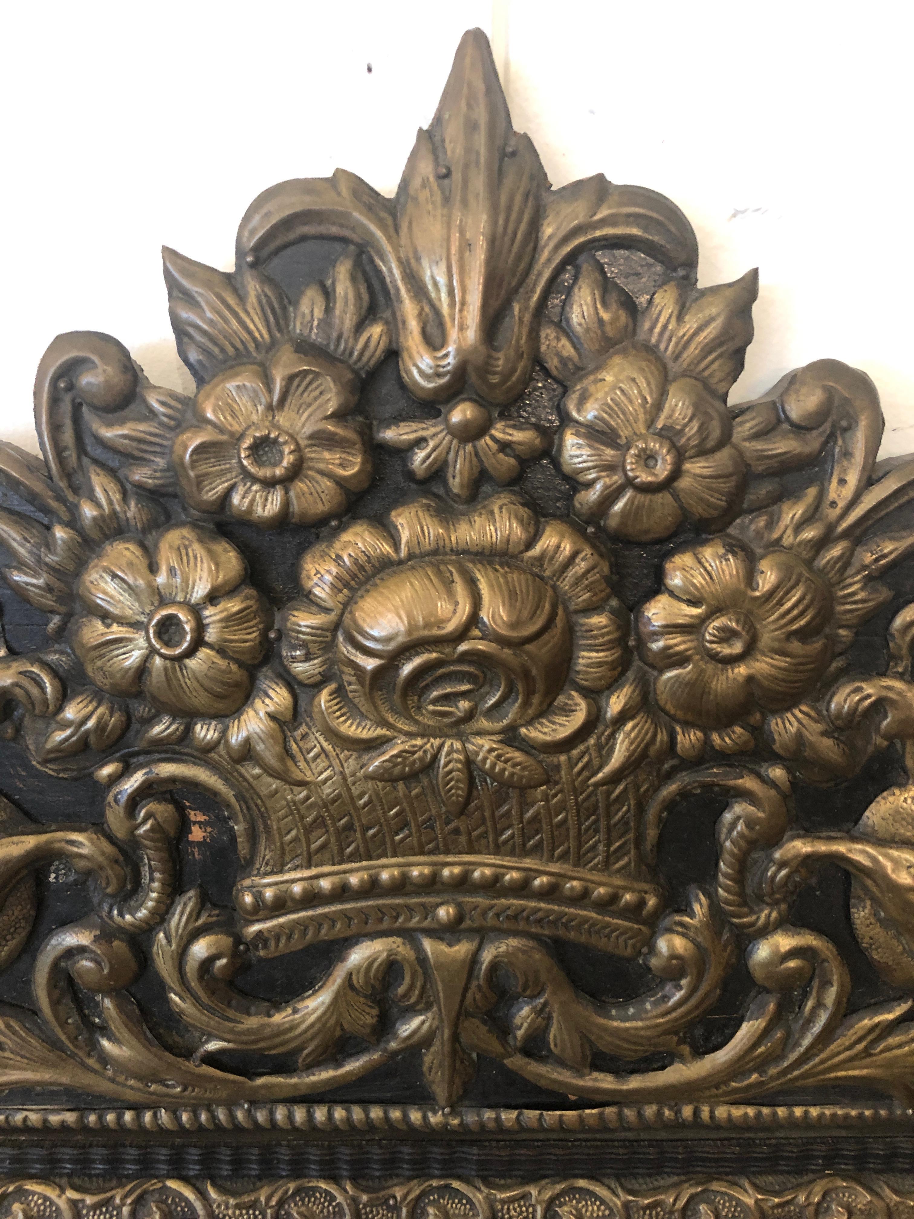 French Large Ornate Repousee Brass and Ebonized Cushion Mirror