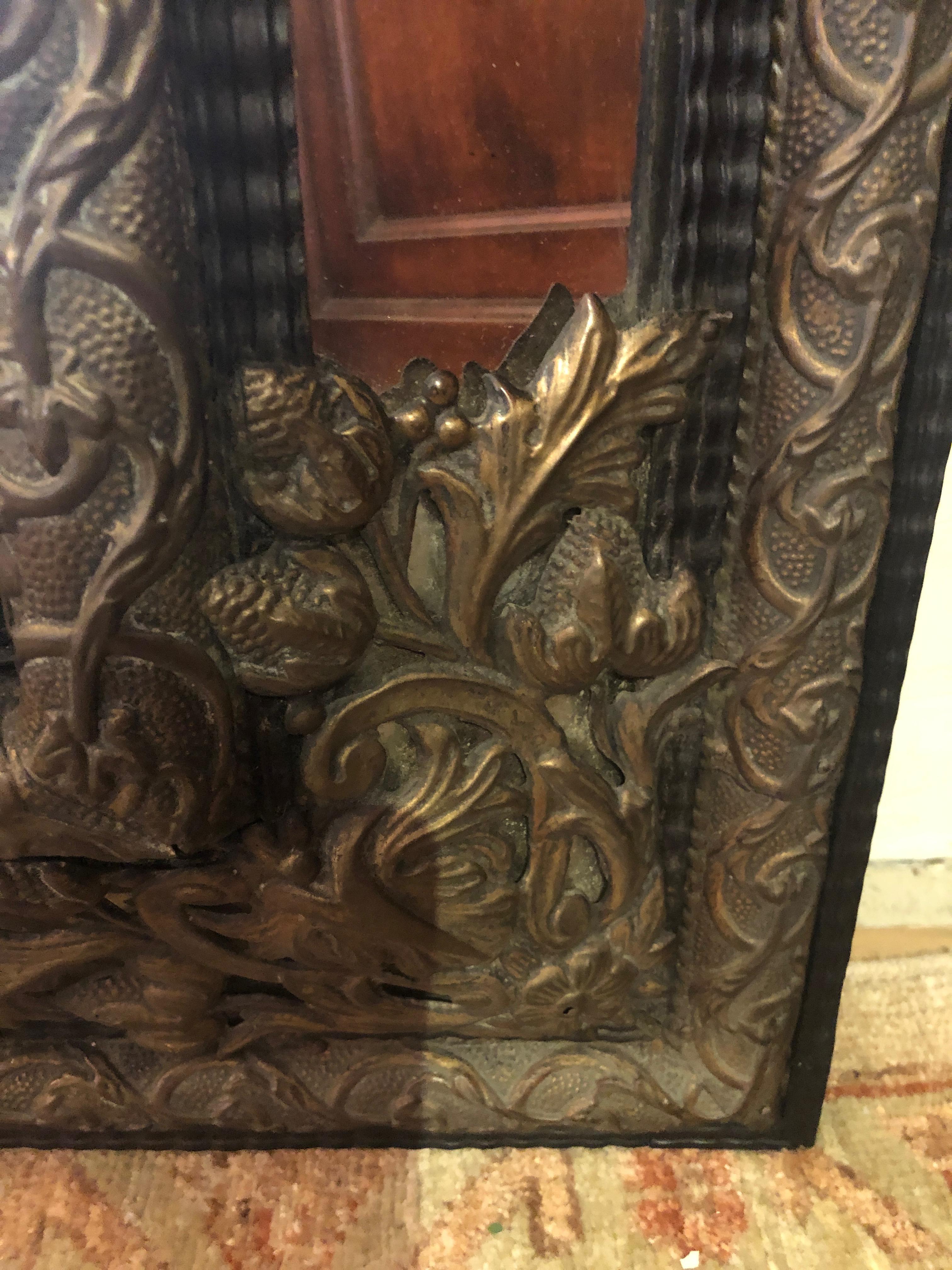 19th Century Large Ornate Repousee Brass and Ebonized Cushion Mirror