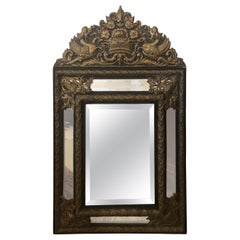 Large Ornate Repousee Brass and Ebonized Cushion Mirror