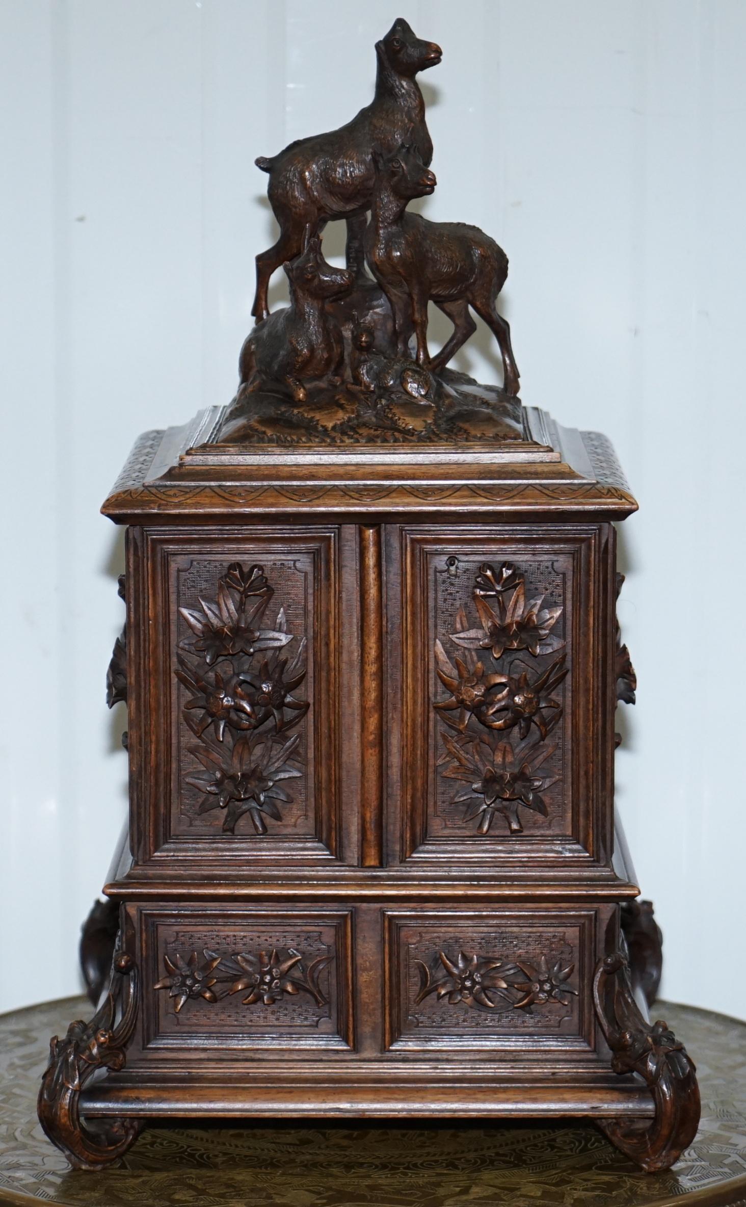 We are delighted to offer for auction this very rare original Black Forest wood hand carved large Jewellery box

There are multiple high definition super-sized pictures at the bottom of this page

A very grand and distinctive piece, the top