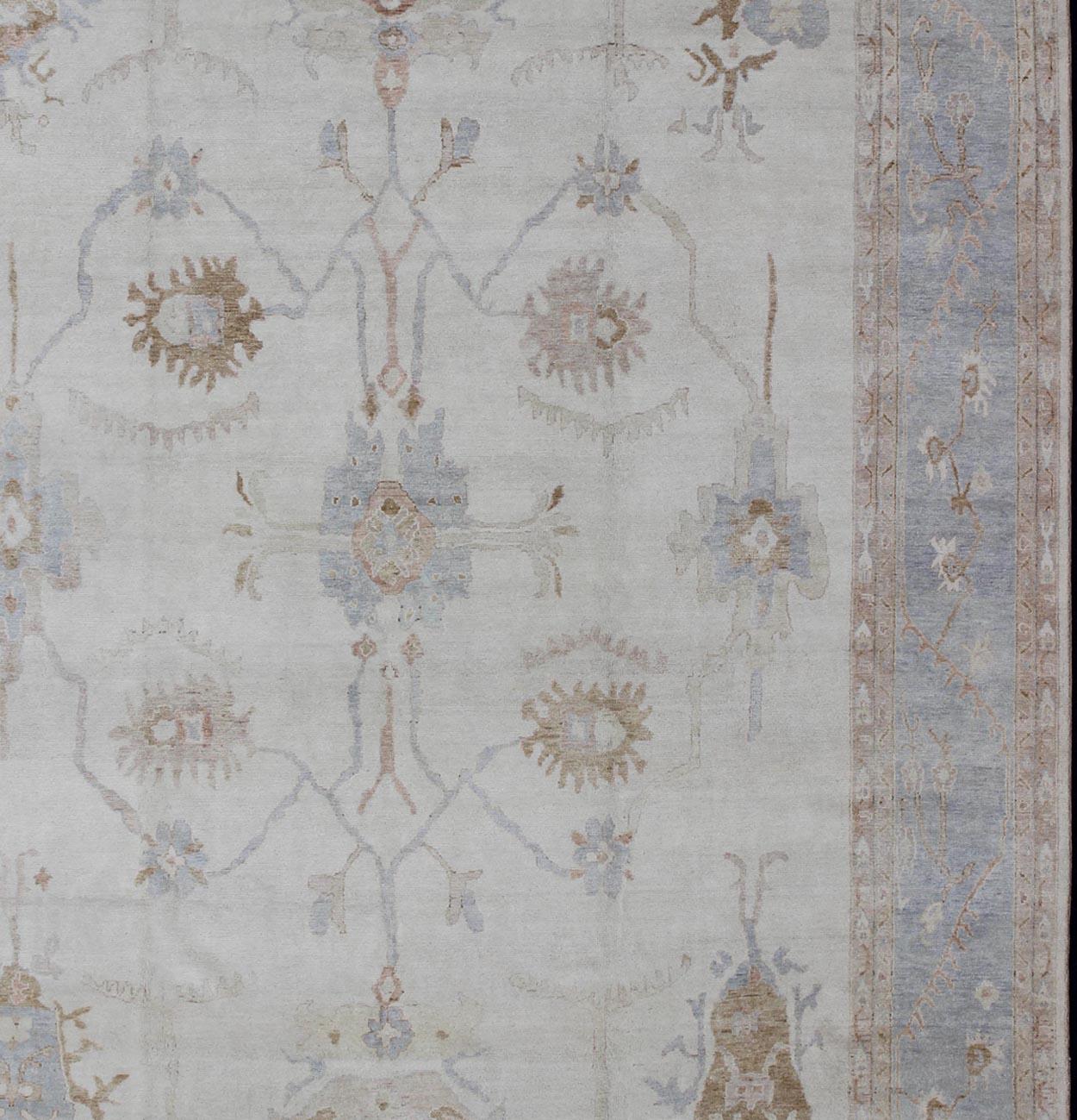 Large Oushak hand knotted rug in light blue, ivory/white & light brown, Rug/BDH-711387 , country of origin / type: India / Oushak

Measures: 11'8 x 15'7.