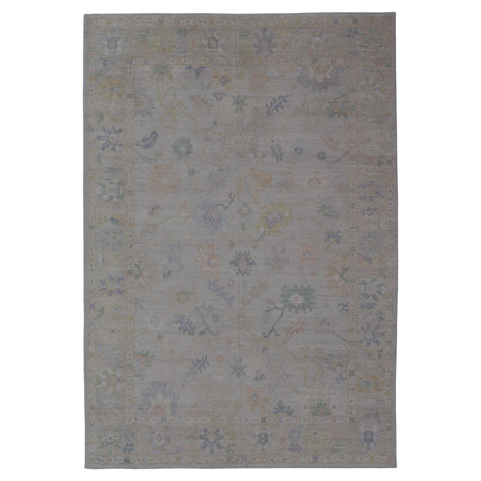 Large Oushak Rug with Floral Motifs & Muted Colorful Tones by Keivan Woven Arts For Sale