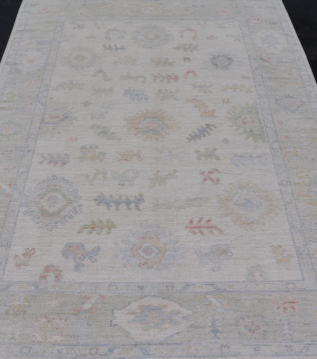 Large Oushak Rug with Floral Motifs & Muted Colorful Tones on Neutral Background For Sale 4