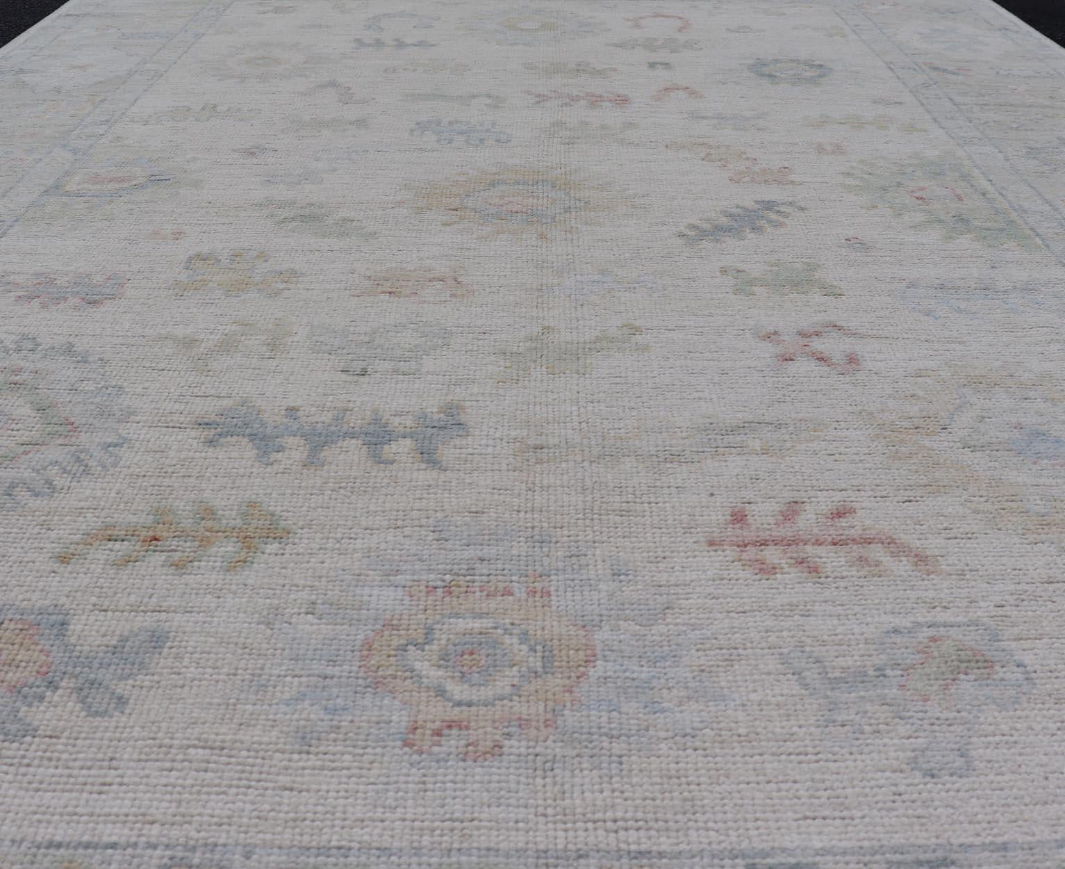 Large Oushak Rug with Floral Motifs & Muted Colorful Tones on Neutral Background For Sale 5