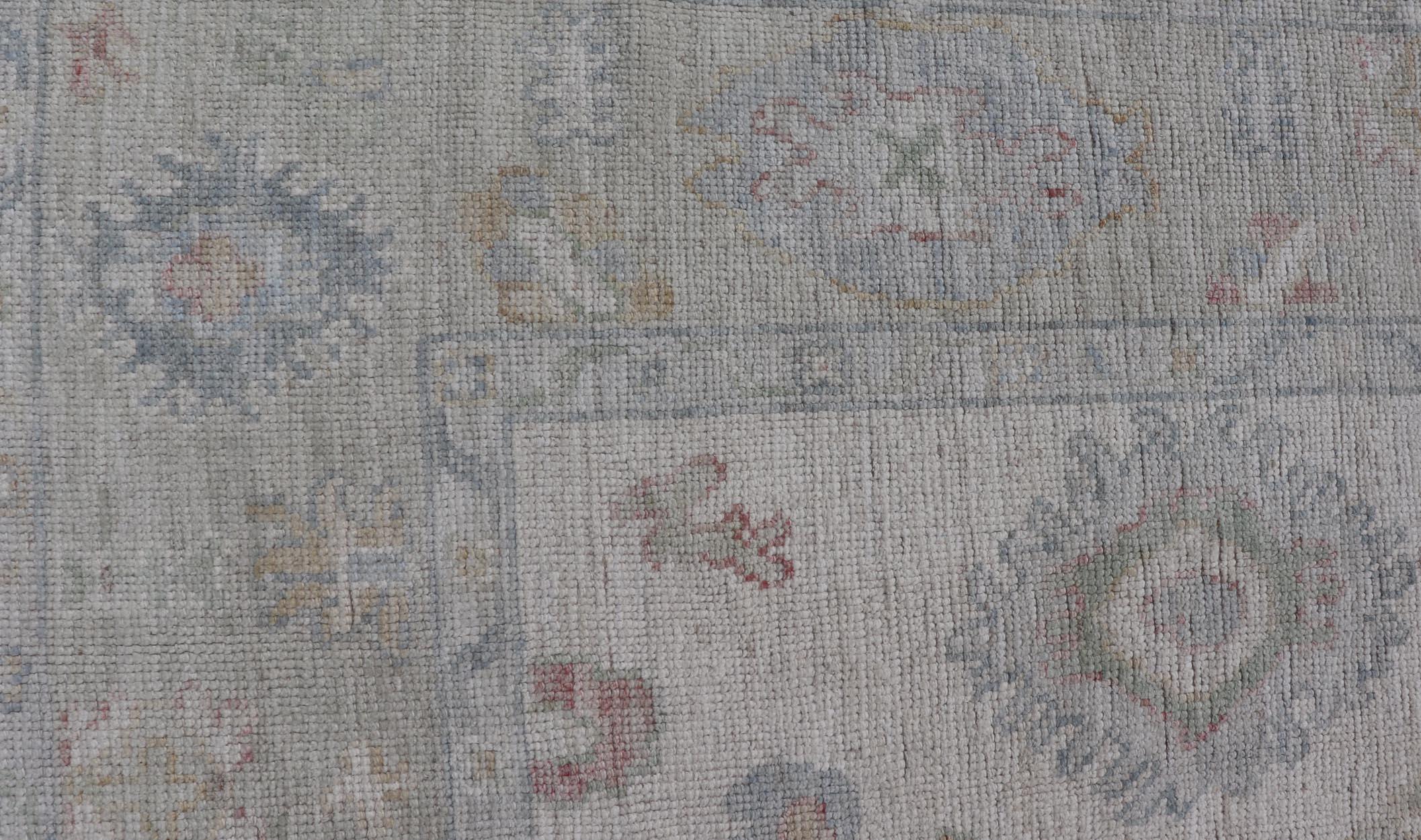 Afghan Large Oushak Rug with Floral Motifs & Muted Colorful Tones on Neutral Background For Sale