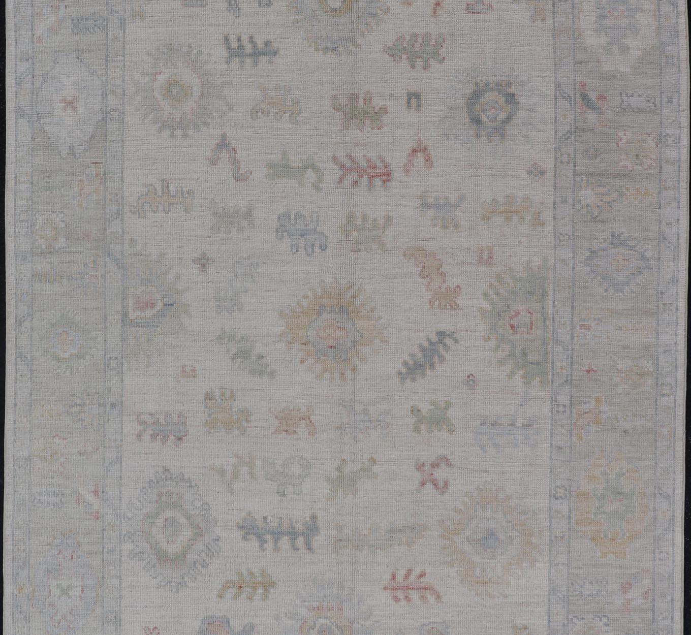 Large Oushak Rug with Floral Motifs & Muted Colorful Tones on Neutral Background In New Condition For Sale In Atlanta, GA