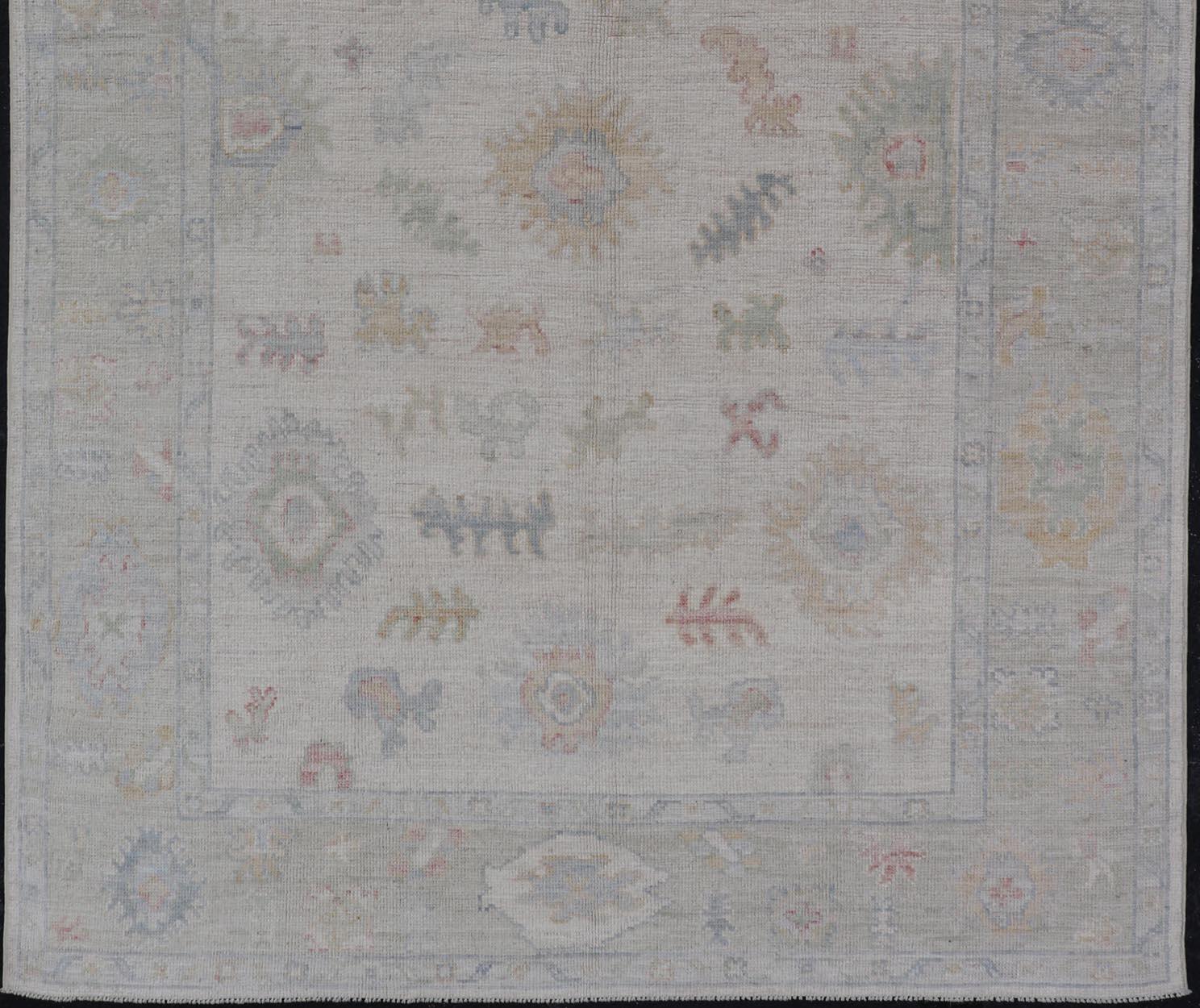 Contemporary Large Oushak Rug with Floral Motifs & Muted Colorful Tones on Neutral Background For Sale