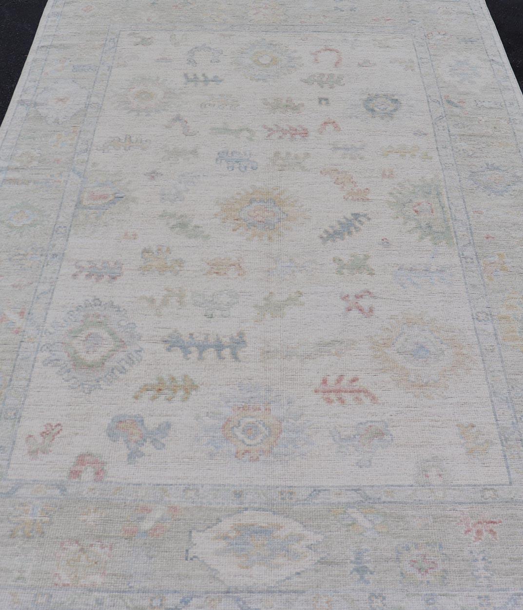 Large Oushak Rug with Floral Motifs & Muted Colorful Tones on Neutral Background For Sale 1