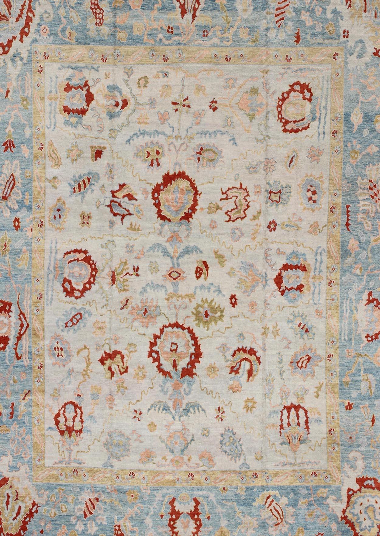 Hand-Knotted Large Oushak Turkish Rug with All Over Design in Light Blue, Ivory & Red  For Sale
