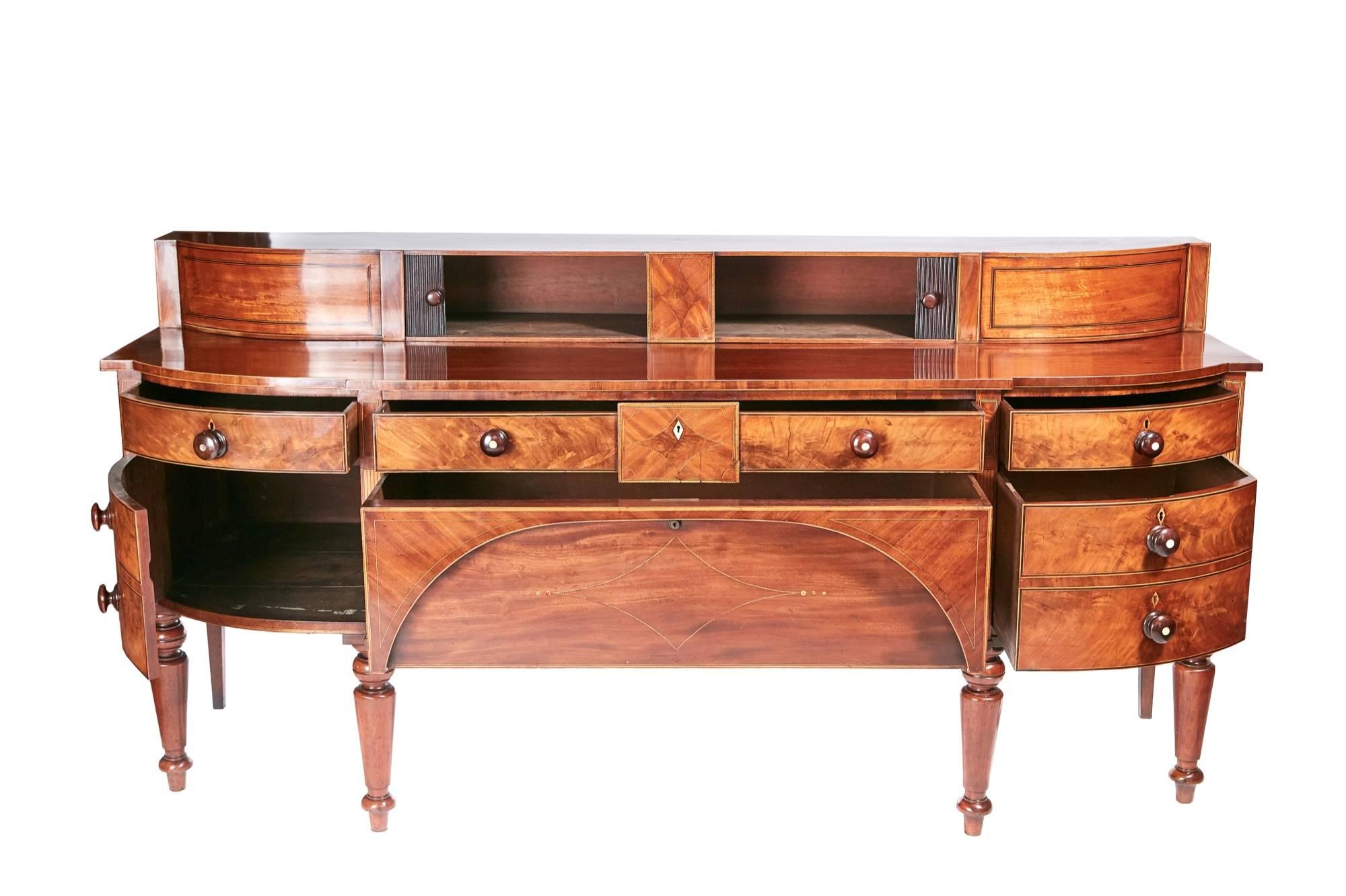 Large outstanding quality Georgian inlaid mahogany sideboard, the back of the sideboard has original sliding tambors and satinwood inlay, the breakfront base with five figured mahogany drawers and one cupboard door all inlaid with satinwood original