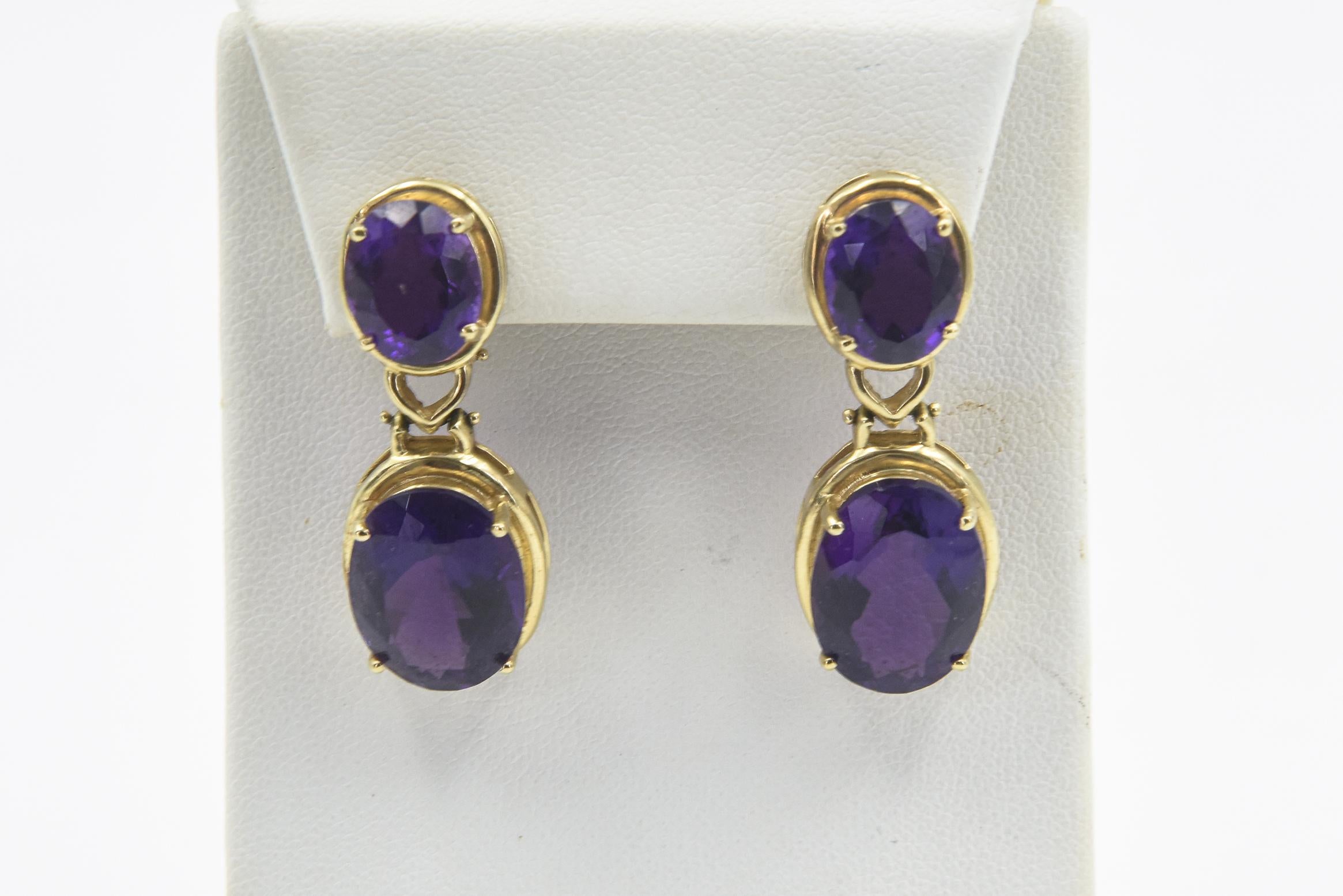 Large faceted gorgeous purple oval amethyst mounted in a 14k yellow gold bezel. The amethyst with out the mounting is approximately 1.95