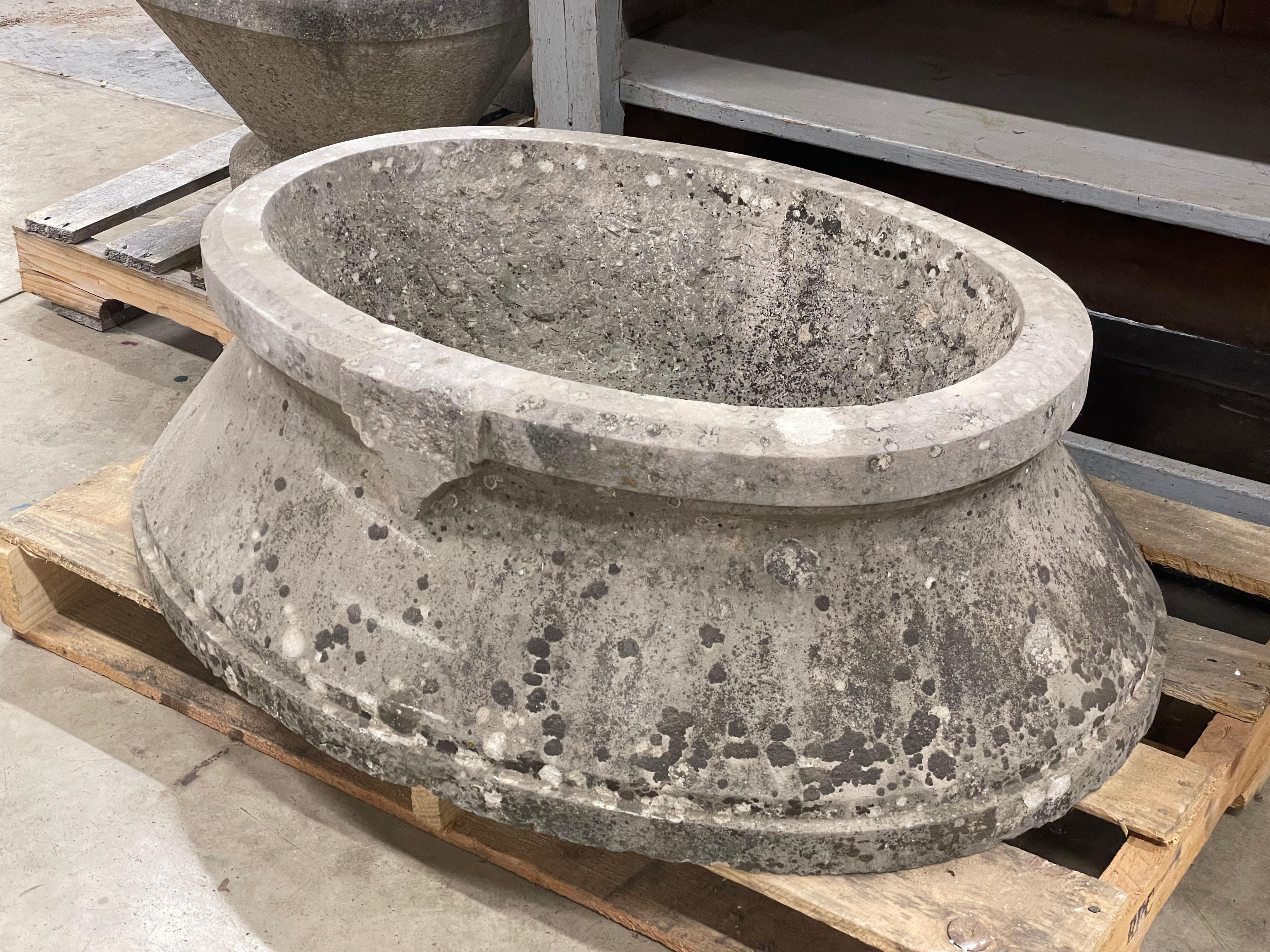 Large antique carved oval limestone trough. It has a drain hole and could also ne used as a sink.