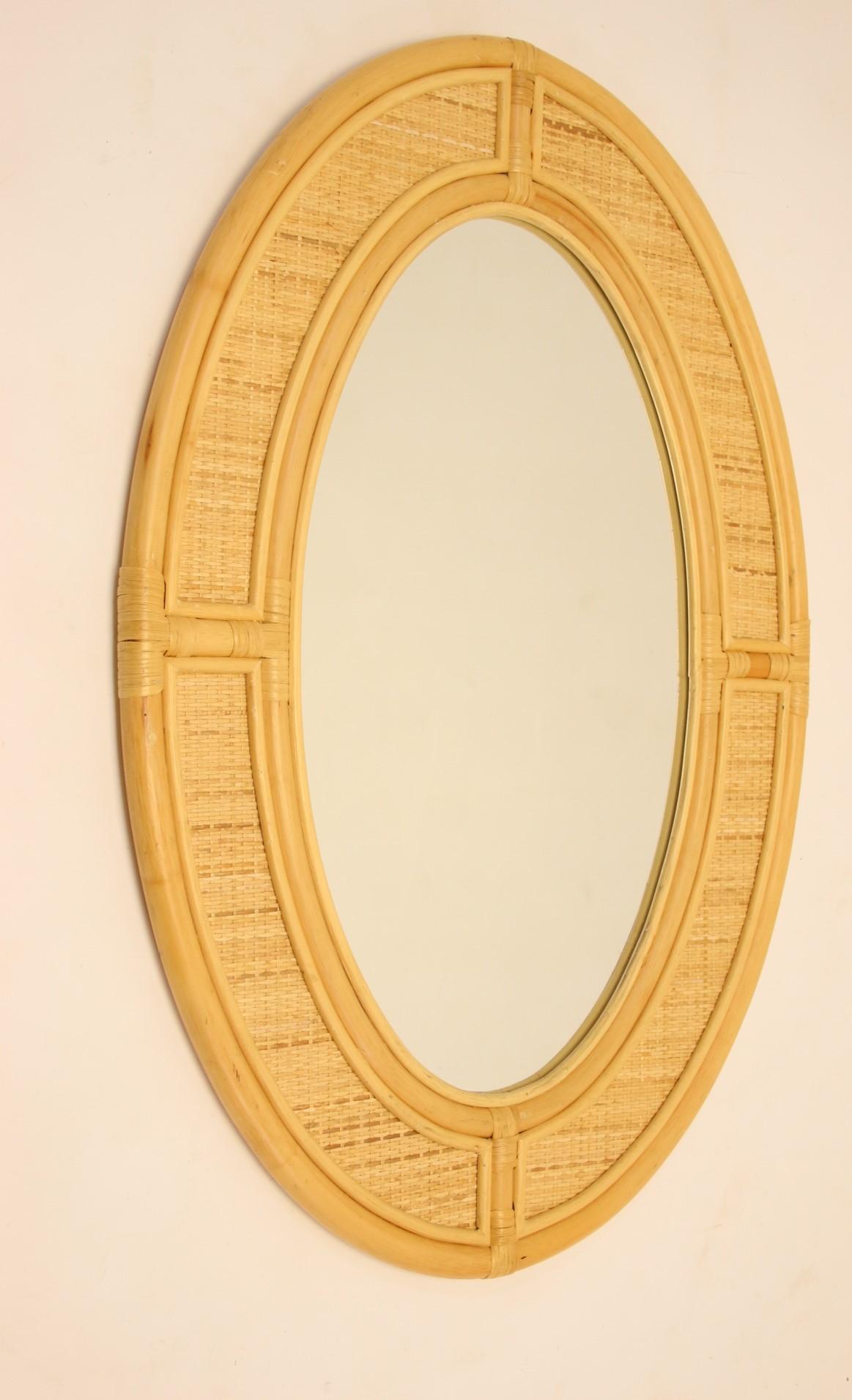 Large oval bamboo wall mirror


A large hanging wall mirror made from bamboo and wicker from the 60s

With a nice and beautiful details on the edge.