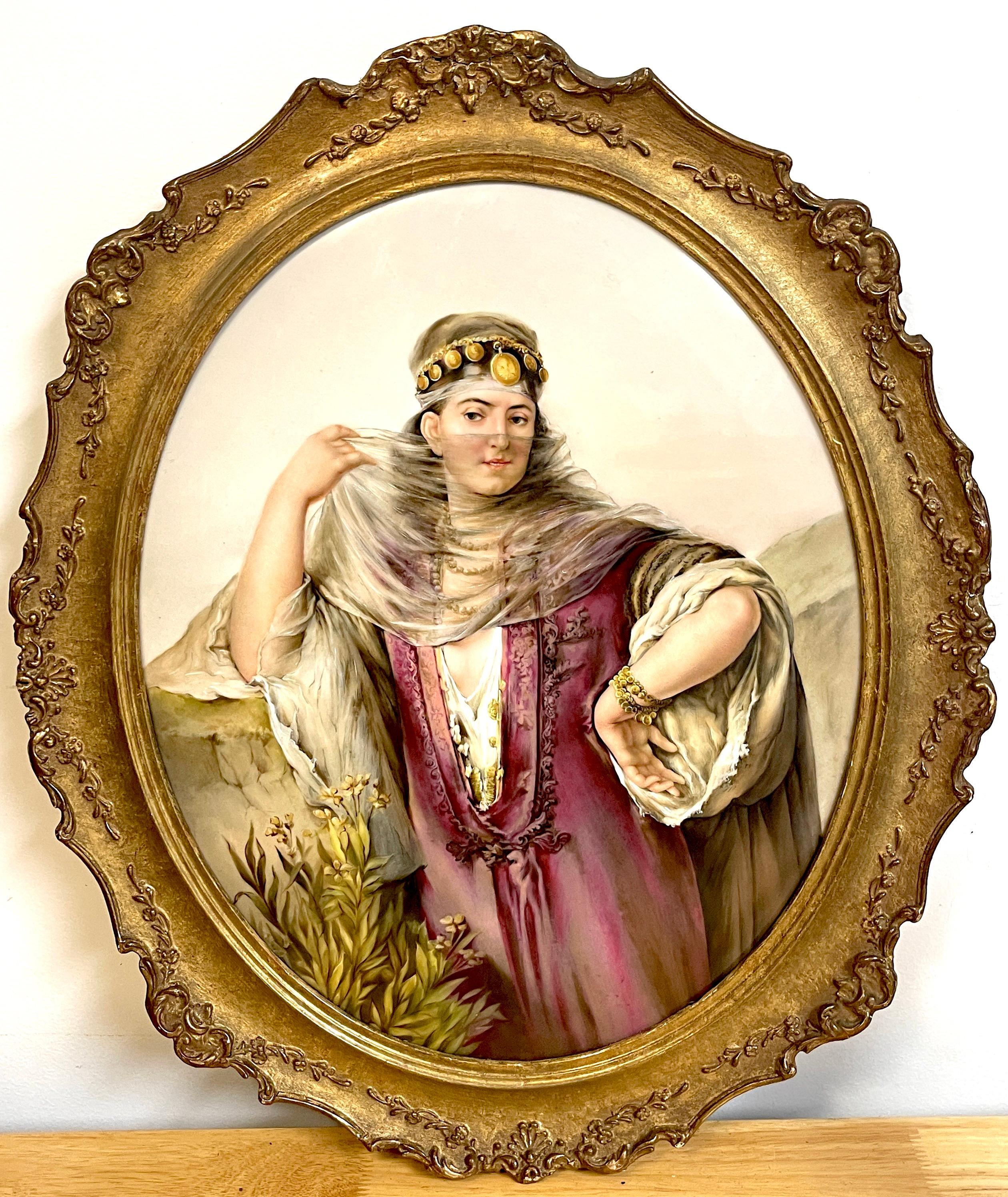 Large oval Berlin (K.P.M.) Porcelain plaque of a harem dancer
Exceptional painting of a veiled exotically dressed and jeweled dancer, in landscape. 
Impressed K.P.M. and scepter mark to reverse, with other factory marks.
Plaque: 17 H x 13 1/2 W