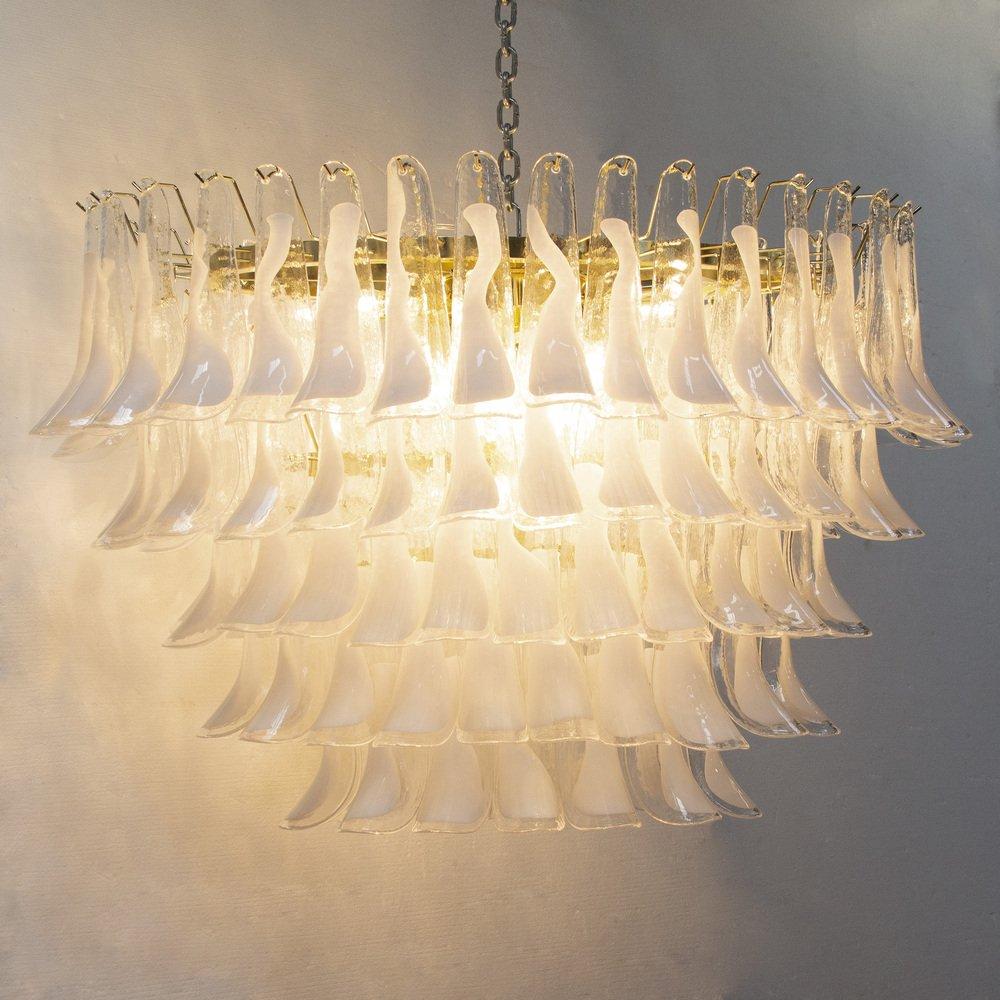 Large oval pendant chandelier Ø115 cm Made in Italy with crystal and white petals in Murano glass.

Additional information:
Material: Brass, Glass, Metal, Murano Glass, Steel
Type: Chandelier
Collection: Selle
Chain and ceiling rose: included in the