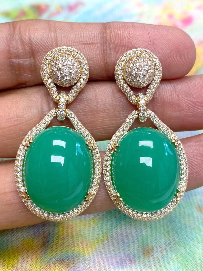 Large Flat Oval Chrysoprase Pendant with Diamonds in 18k Yellow Gold, from 'G-One' Collection

Stone Size- 22 x 18 mm

Gemstone Weight: Chrysoprase- 33.82 Carats

Diamond: G-H / VS, Approx Wt: 1.04 Carats

Large Oval Chrysoprase Earrings with