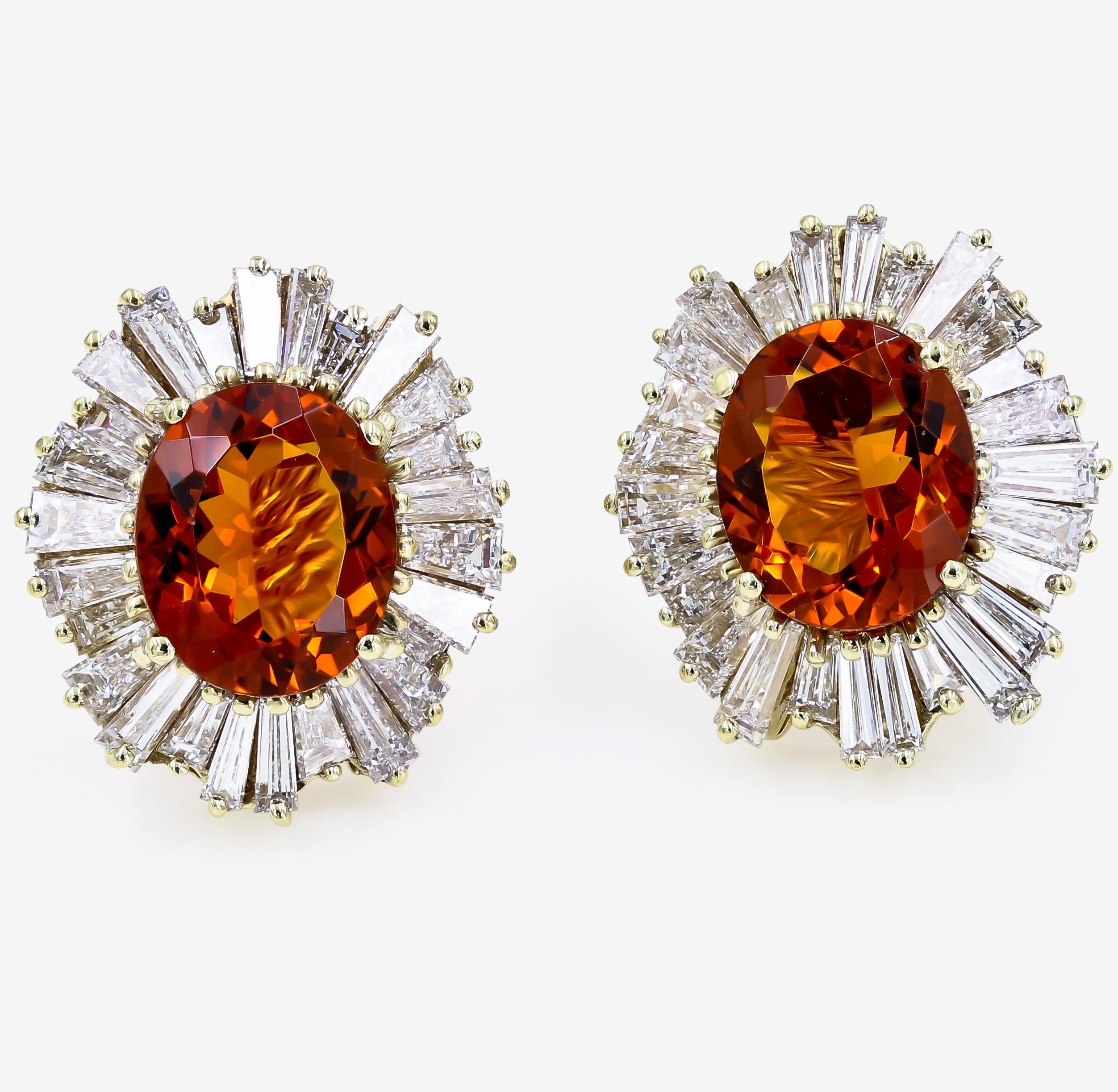 Two large oval Citrines are the focus of these stunning earrings set in 18kt. yellow gold. The two Citrines weigh  7.25cts. t.w. and are surrounded by 52 tapered baguette diamonds weighing approximately = 6.07cts. t.w. (the diamonds are G in color,