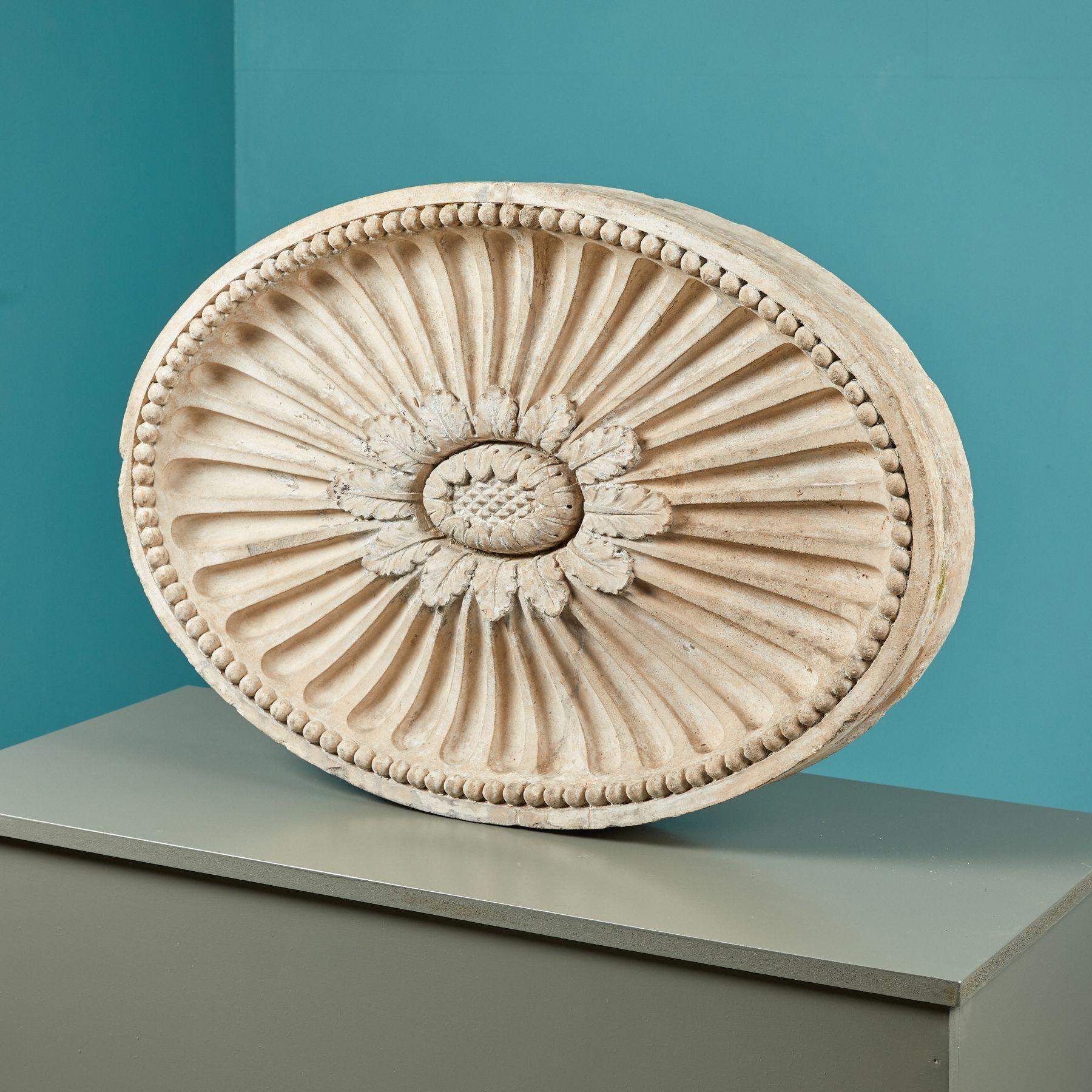 In classic architecture, a large patera (or paterae plural) like this would have once embellished a frieze or wall of a prominent building or house. This oval patera is a beautiful example of 18th century architecture, showcasing ornate details of