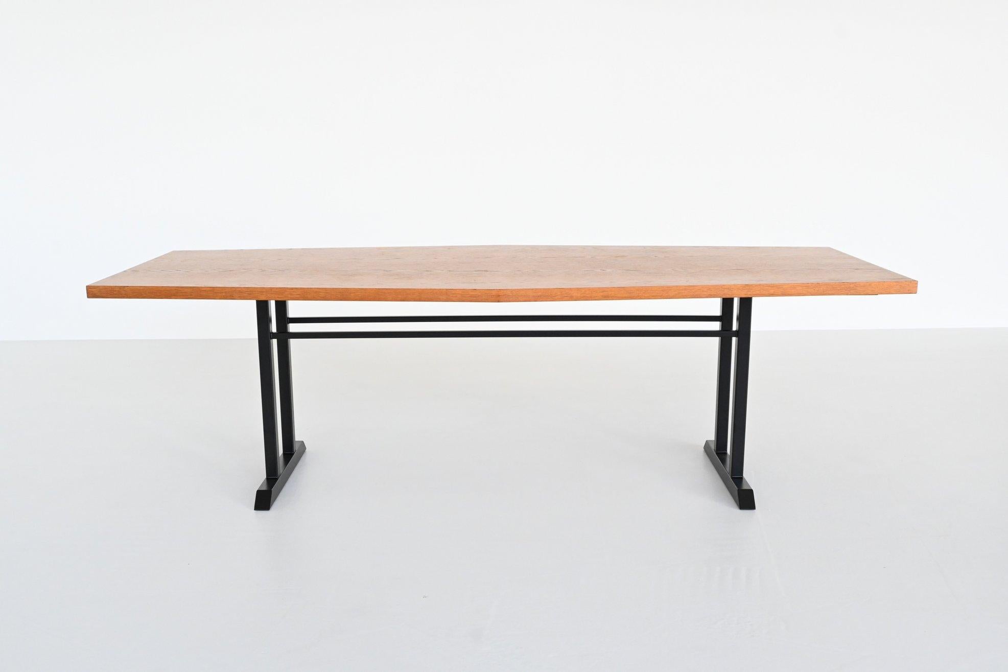 Beautiful shaped large conference or dining table, The Netherlands 1970. This very nice and unique dining table has a large tapered / oval top made of veneered oak wood. The top consists of one part with a length of 240 cm and a width of 80 to 100