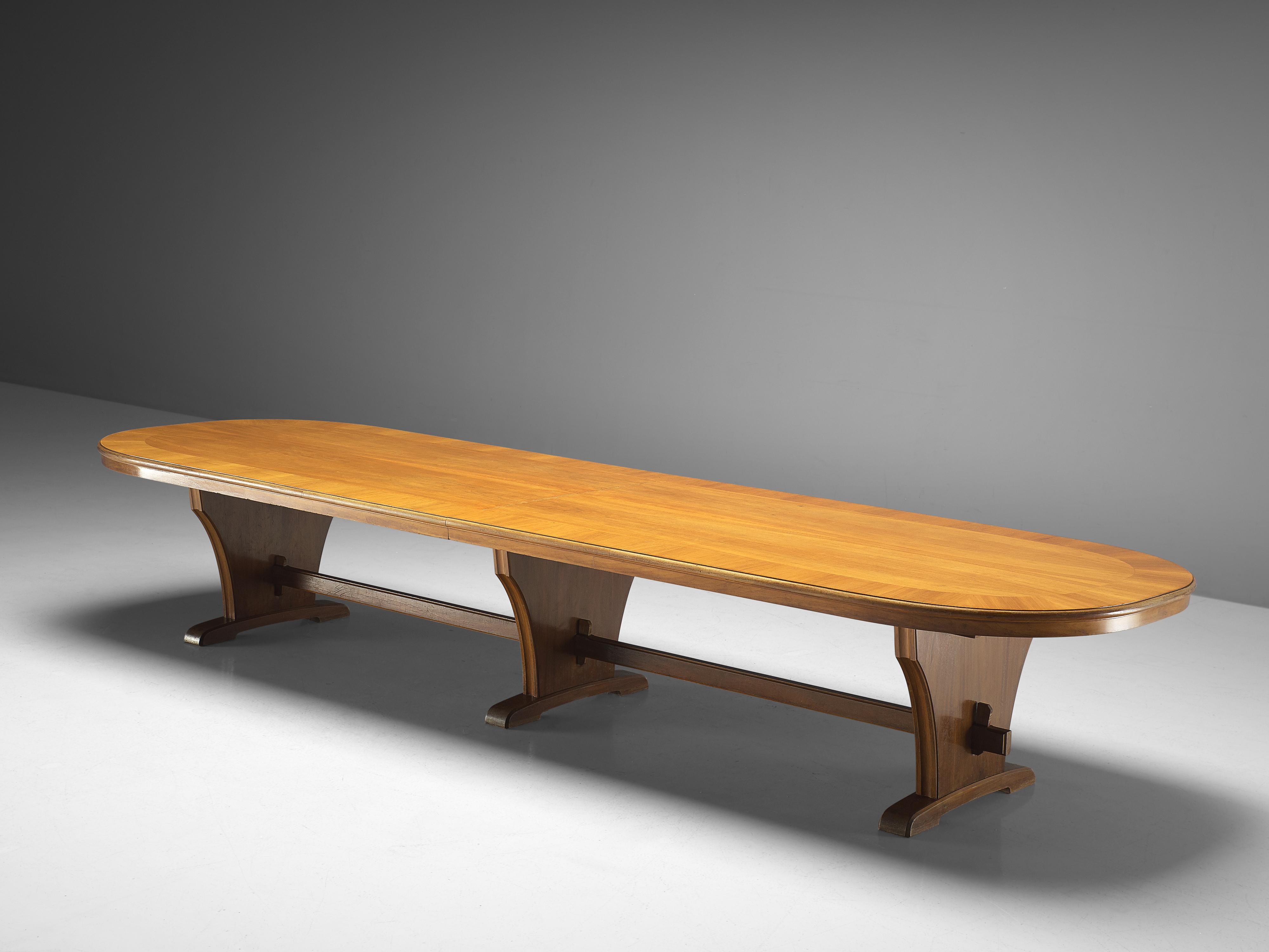 Conference table, veneered walnut, wood, Germany, 1950s

Very large oval dining or conference table with three legs. The mirrored grain of the book-matched Italian walnut is beautifully surrounded with an inlayed frame. Not only the tabletop has