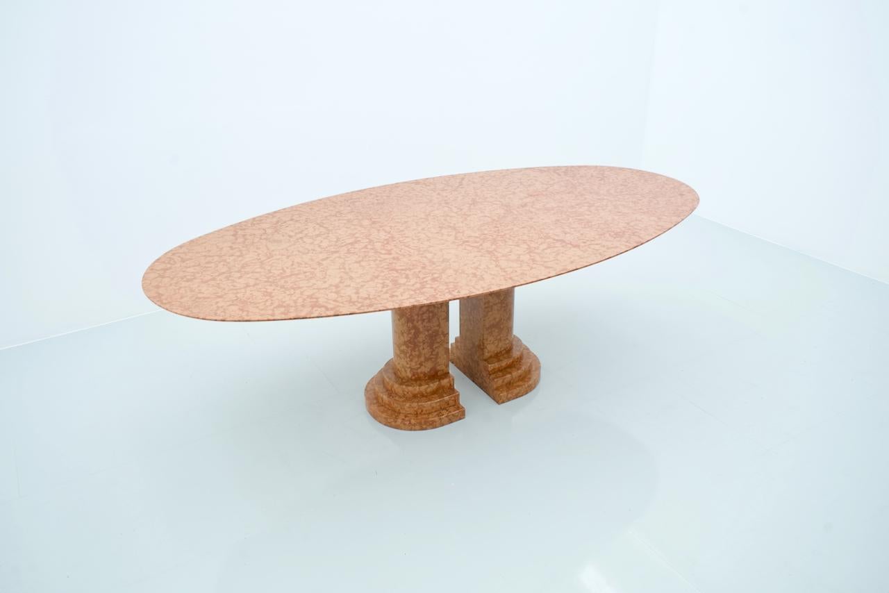 Large oval dining table in red Rosso Asagio marble. The table is from Italy and was bought in the 1980s. The tabletop sits on two heavy marble columns.
Very high-quality table in very good condition, very heavy.