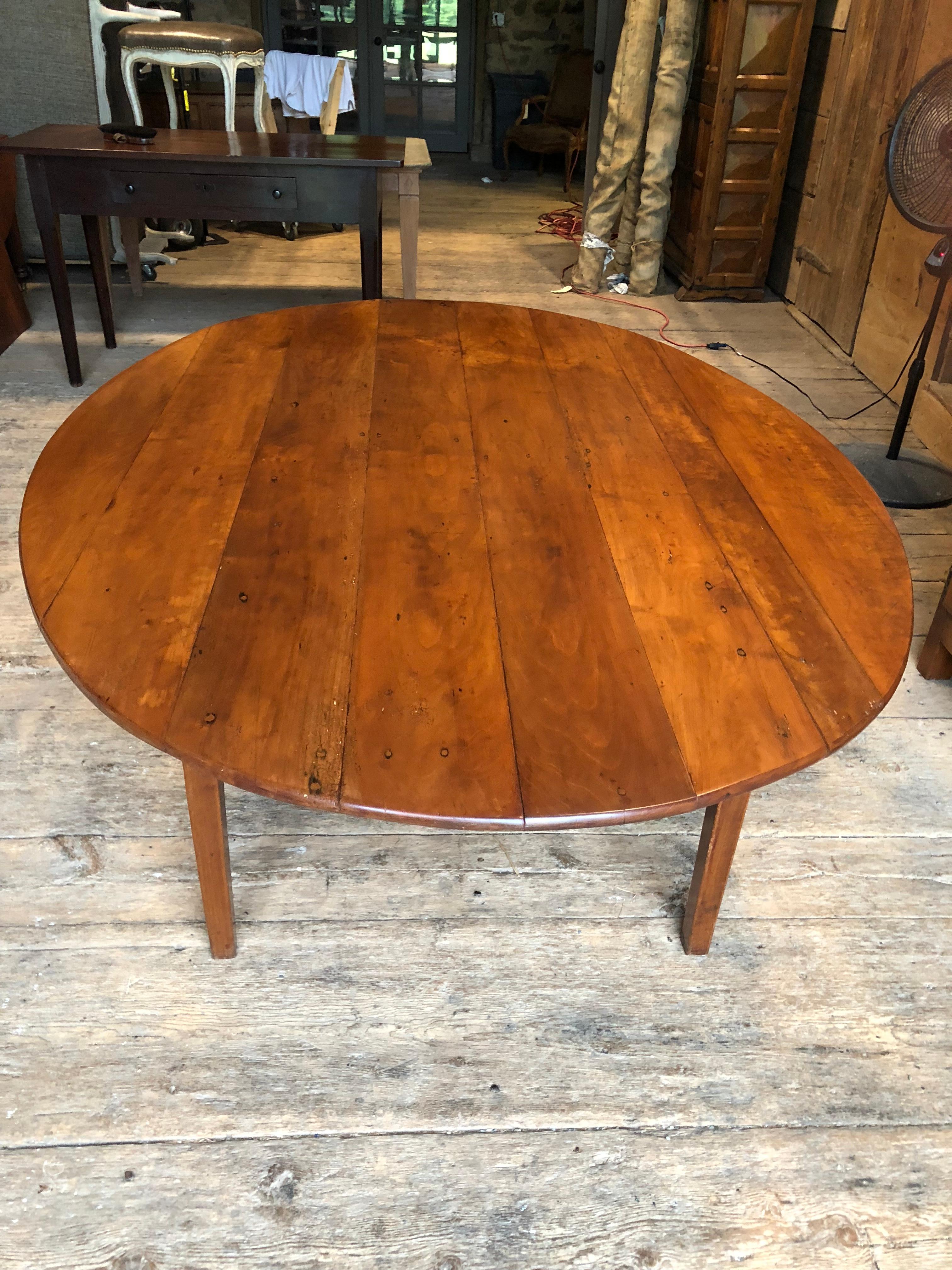 A great oval farm table in cherrywood purchased from Pierre Deux Antiques in the 1980s, with a random width plank top and simple tapered legs, French, circa 1850. Can seat ten comfortably, 12 in a pinch.
Top is removable for easy transport.