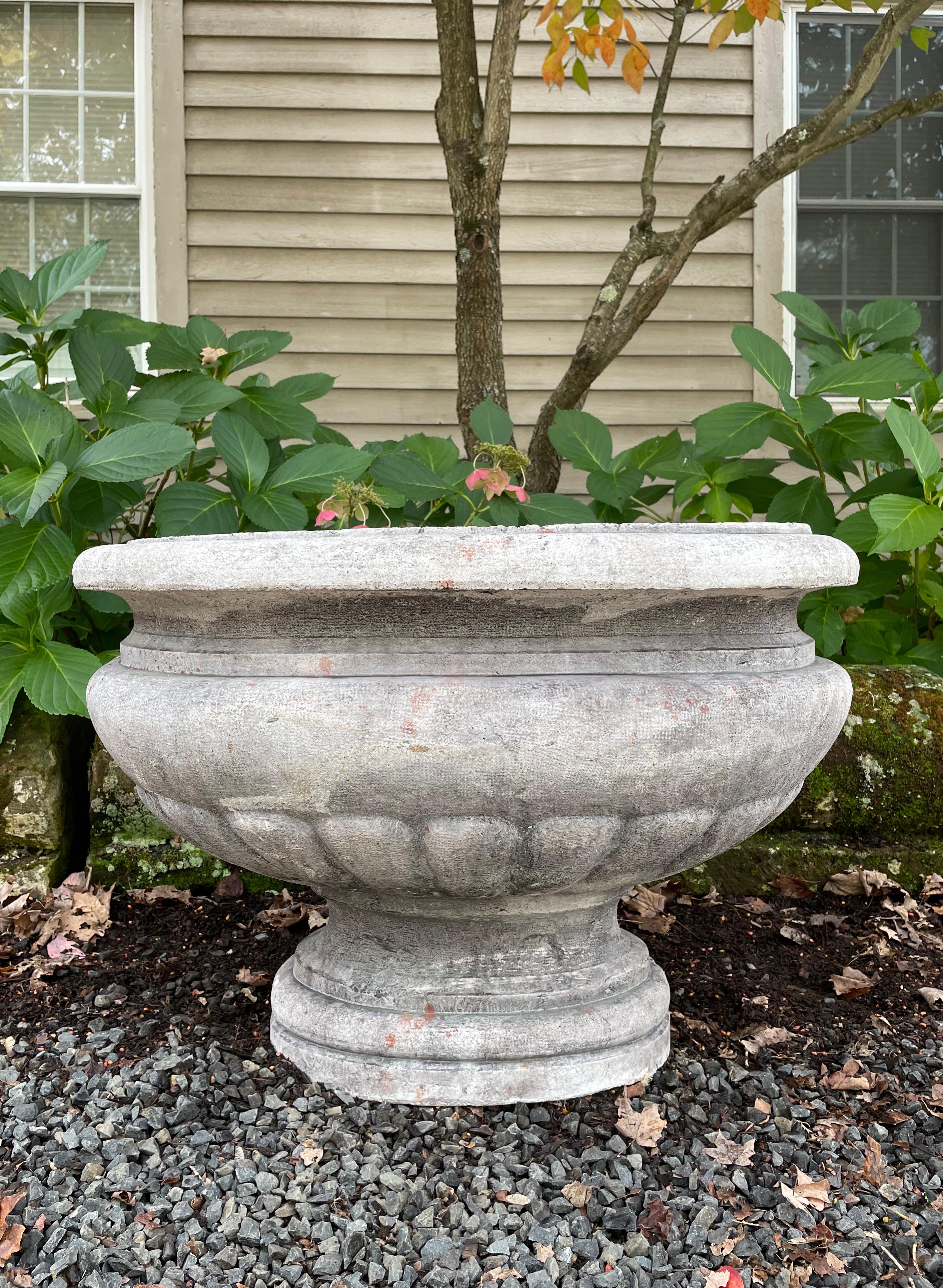 Hand-carved from Pierre de Bourgogne (Burgundy Stone) that is extremely hard, durable and very heavy, this fine and large Neoclassical oval jardiniere dates to around 1790 and is in gorgeous condition. Elegant in form, it features a semi-lobed body
